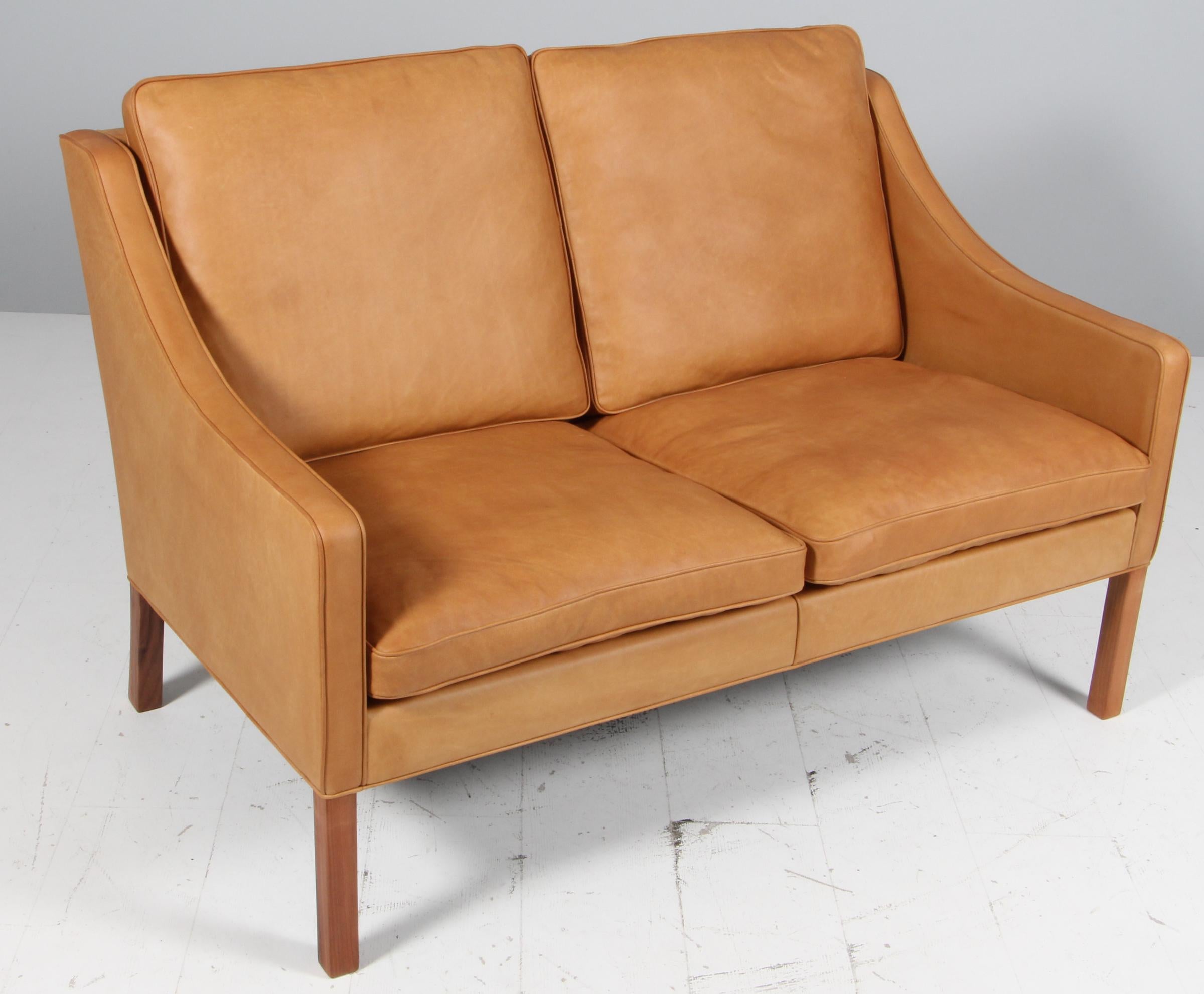 Børge Mogensen two-seat sofa new upholstery with cognac vintage full grain aniline leather.

Legs of mahogany.

Model 2208, made by Fredericia furniture.
