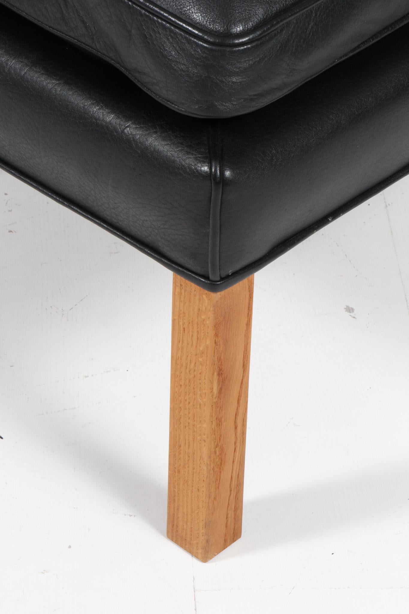 Mid-20th Century Børge Mogensen Wingback Chair and Ottoman, Model 2202 / 2204, leather For Sale