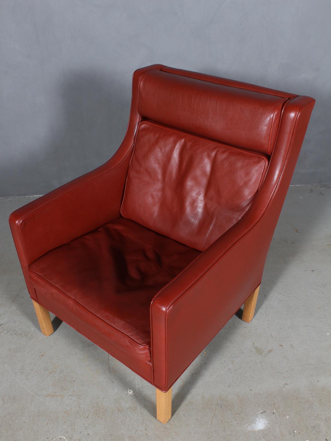 Børge & Peter Mogensen lounge chair in original red / brown leather upholstery. 

Legs in oak.

Model 2431, made by Fredericia furniture.

This is a cooperation between Børge Mogensen and his son Peter Mogensen.