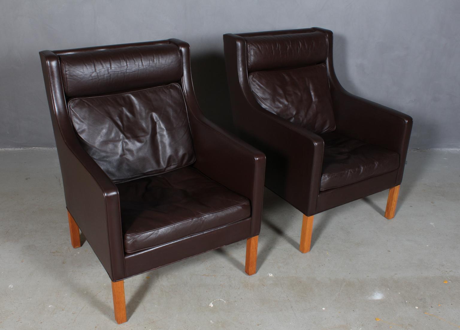 A pair of Børge & Peter Mogensen lounge chairs in original brown leather upholstery. 

Legs of oak.

Model 2431, made by Fredericia furniture.

This is a cooperation between Børge Mogensen and his son Peter Mogensen.'

 