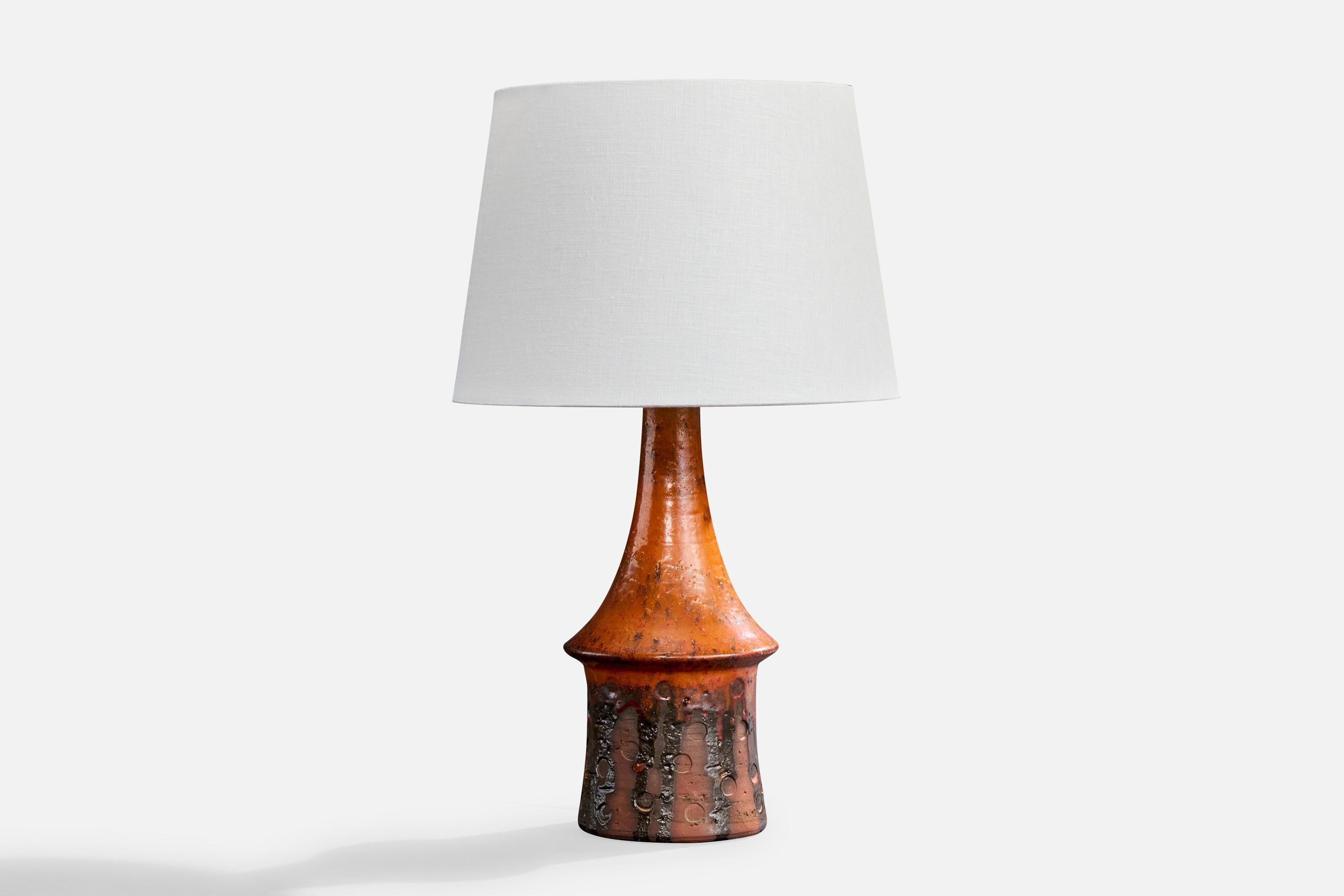 A red-glazed stoneware and white fabric table lamp designed by Architect Børge Wernonch for Afta, Denmark, c. 1940s.

Dimensions of Lamp (inches): 13