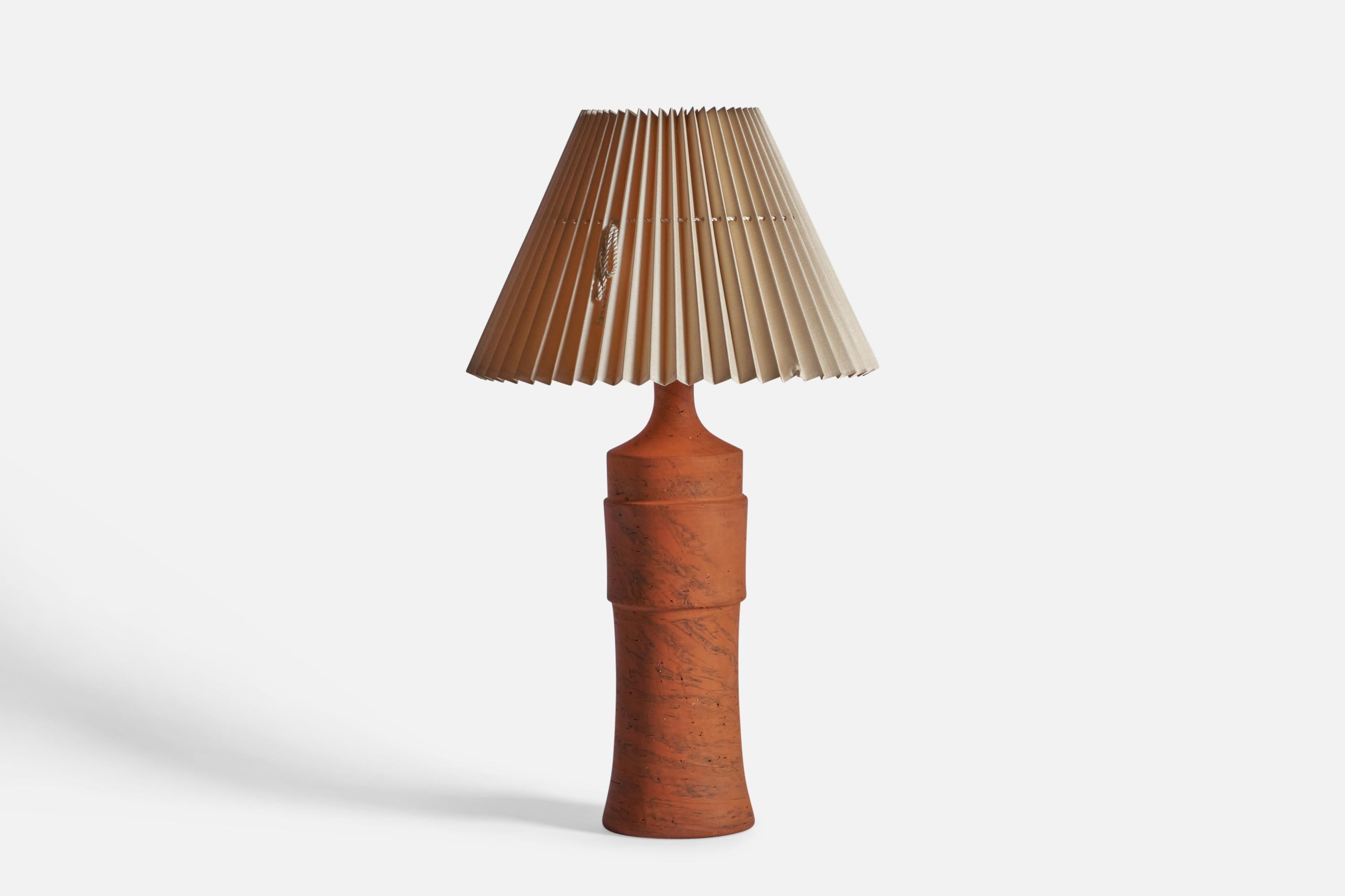 A sizeable unglazed terracotta and paper table lamp, designed by architect Børge Wernonch and produced by Afta, Denmark, c. 1940s

Sold with Lampshade.

Dimensions stated are of table lamp with lampshade attached.