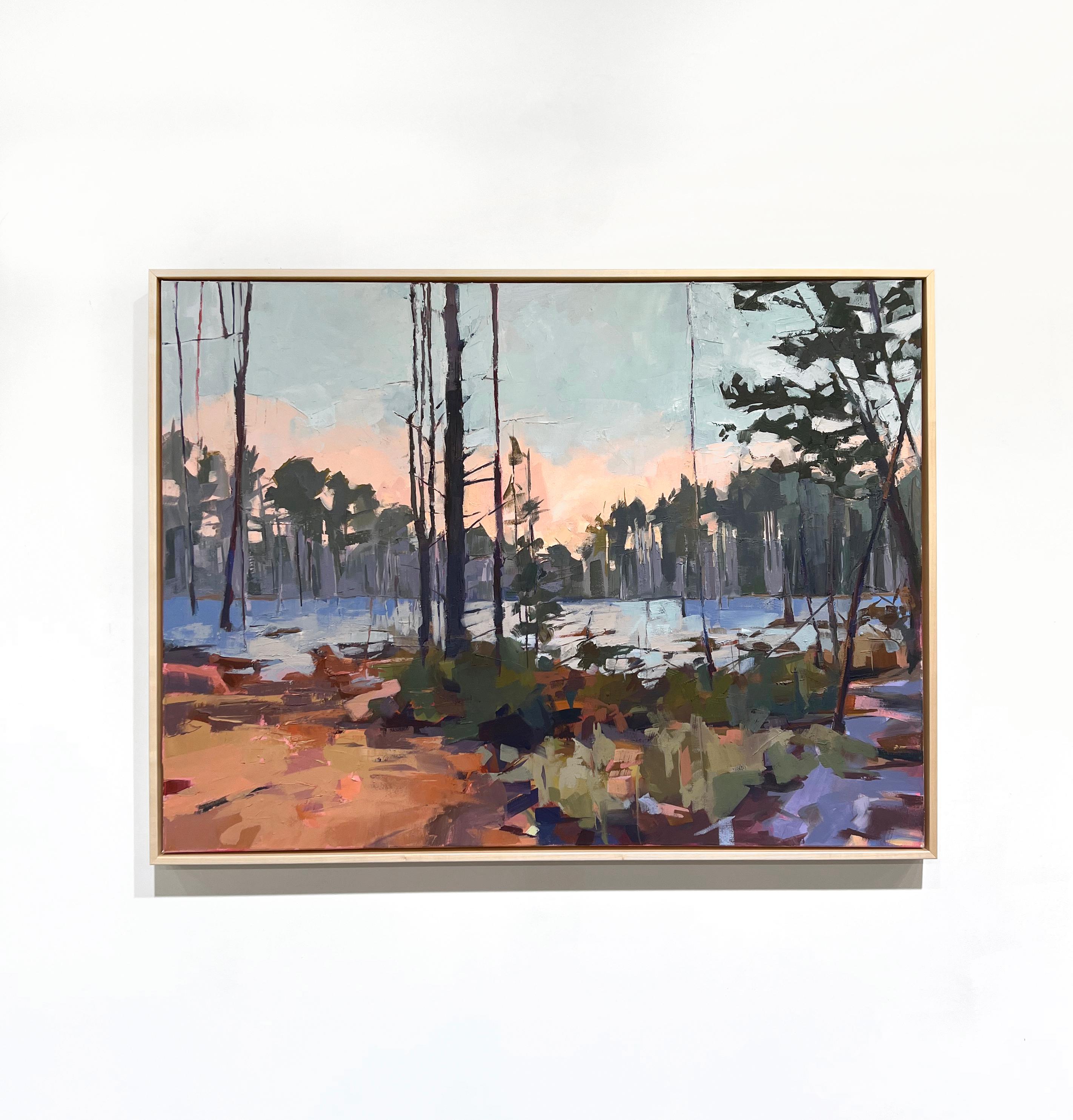 This original abstract landscape painting by Bri Custer is made with oil paint on canvas. It depicts a forest scape and pond, under a salmon pink and blue sky. The piece features both cool, muted greens and blues, which are balanced by warm oranges,
