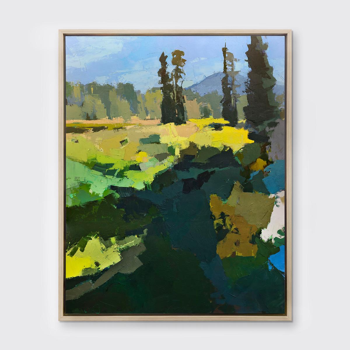 This Limited Edition giclee landscape print by Bri Custer is an edition size of 195. It features a blue and green palette with vibrant yellow accents, and captures an abstracted landscape with large trees in the distance. Printed on canvas, this