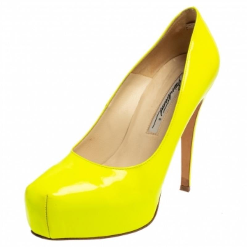 If you are wondering how to wear the neon trend, these Brian Atwood pumps are the answer! Crafted from patent leather, the neon green shade of these beauties make them trendy and highly covetable. They are mounted on 12 cm heels supported by