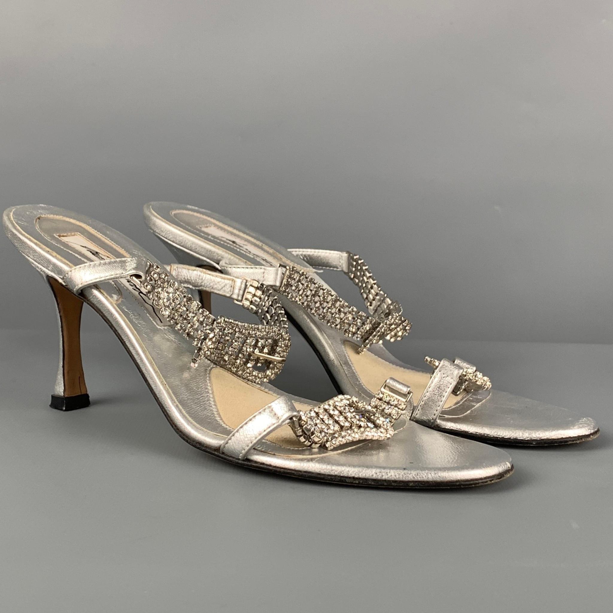 BRIAN ATWOOD sandals comes in a silver leather featuring a buckle rhinestone detail and a stiletto heel. Made in Italy.

Good Pre-Owned Condition.
Marked: 36

Measurements:

Heel: 3 in. 