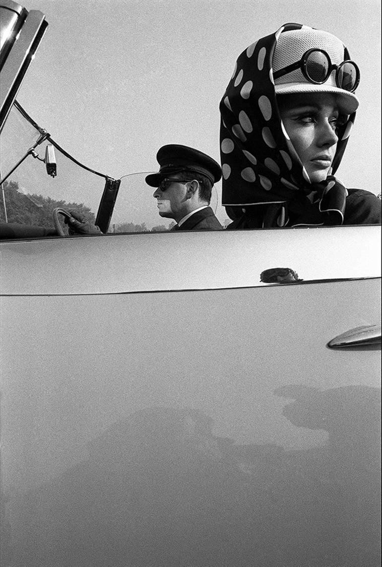 Brian Duffy Figurative Photograph - Girl with Chauffeur, Queen Magazine