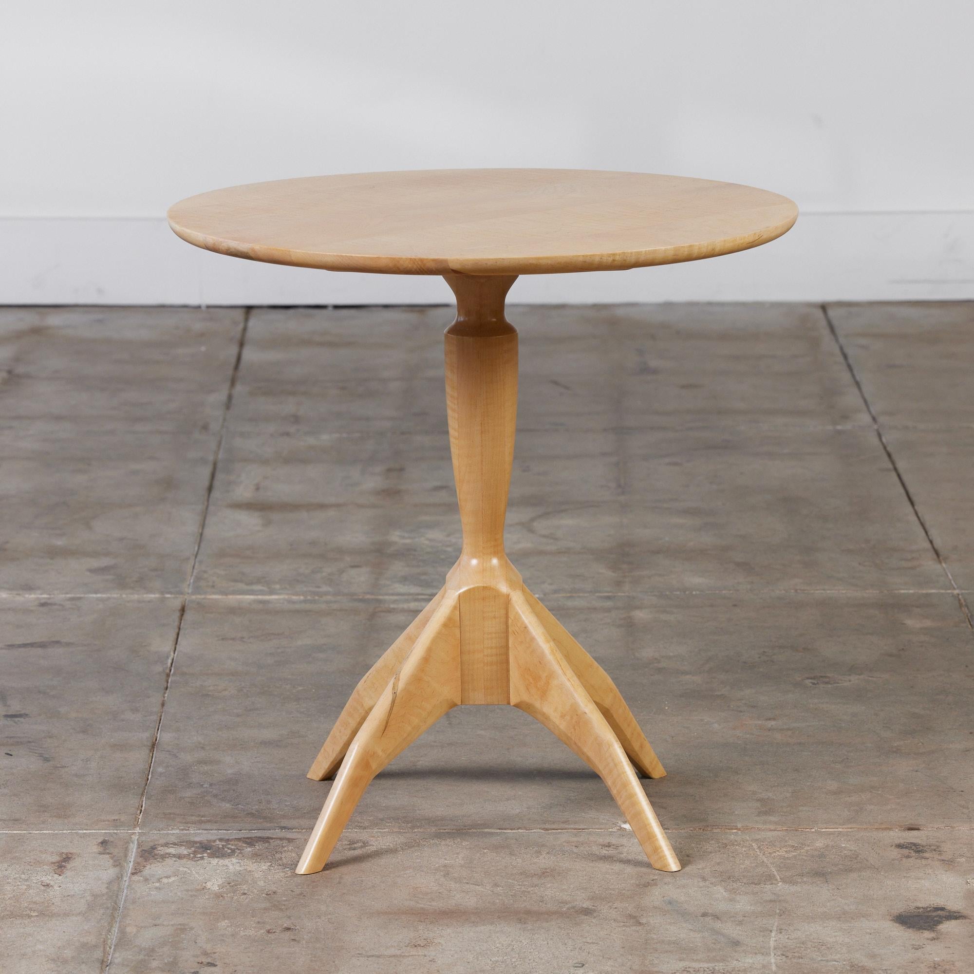 Studio side or occasional table from San Diego wood craftsman Brian Ferris. This contemporary table is crafted from solid maple. The elongated neck and sculptural legs give this piece an elegant feel that is completed by its high gloss table