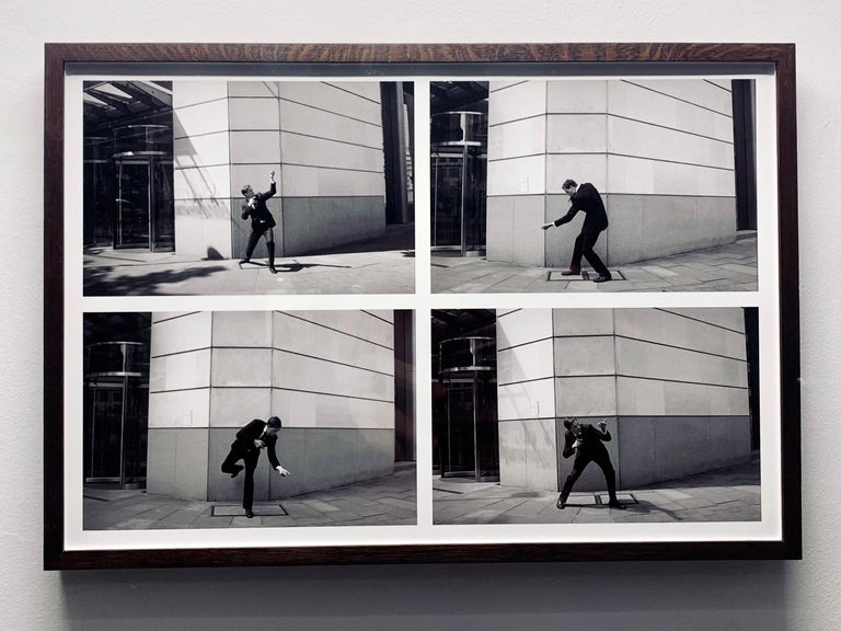 Brian Griffin Take Up Arms by man in suit posing with the invisible