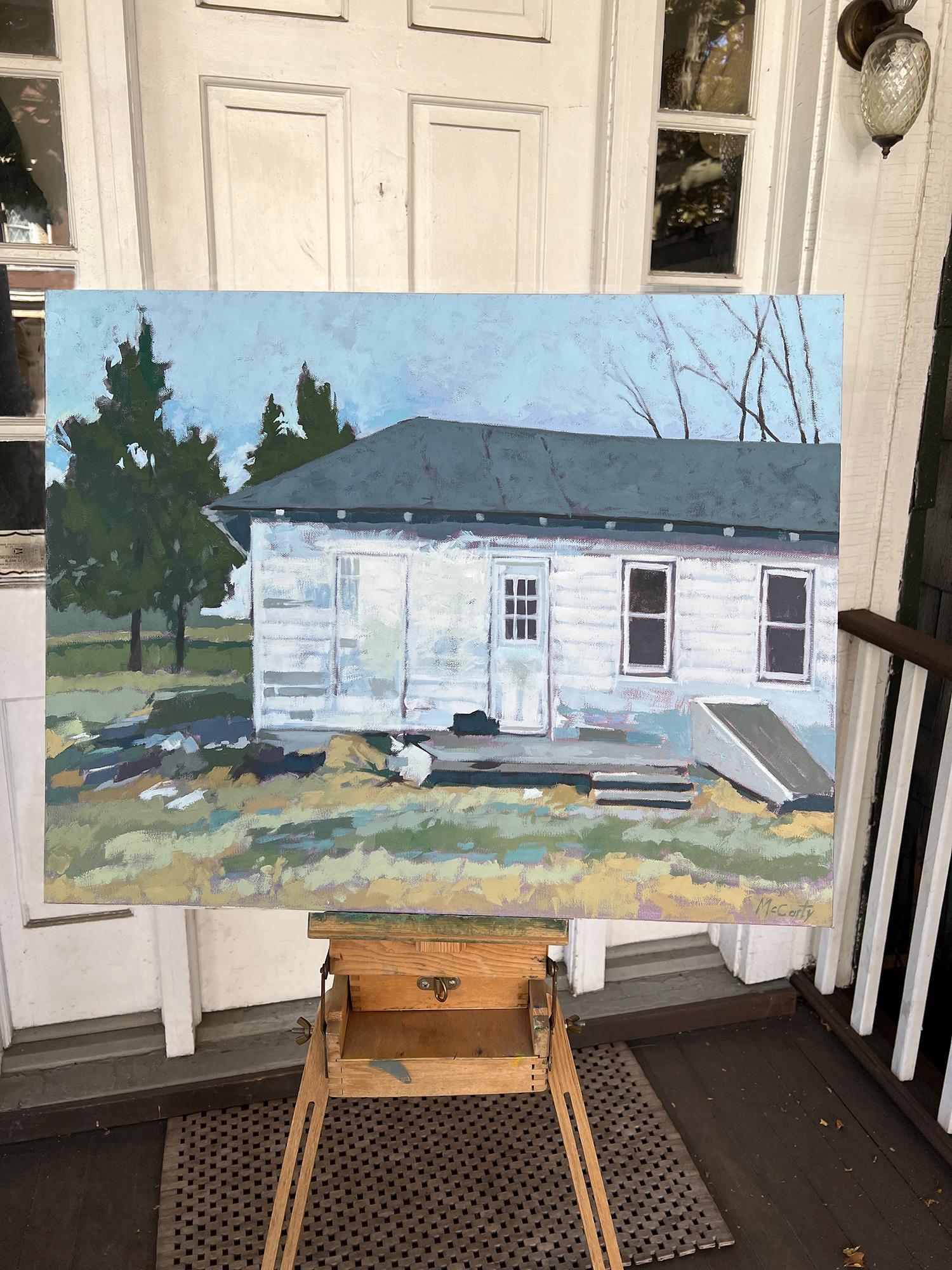 <p>Artist Comments<br />An old white shed stands by the roadside, upright and still in use after many years. Its weathered exterior tells a story of resilience, a familiar sight in the countryside. The structure adds character to the landscape,