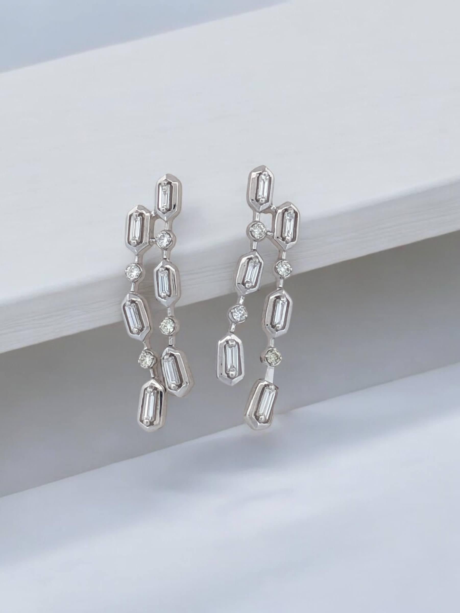 Take your jewelry collection to new heights with the Brianna earrings, crafted in brilliant 14k white gold. These elegant post-back earrings showcase .12 carats total weight of natural baguette diamonds, expertly set to showcase clean lines and