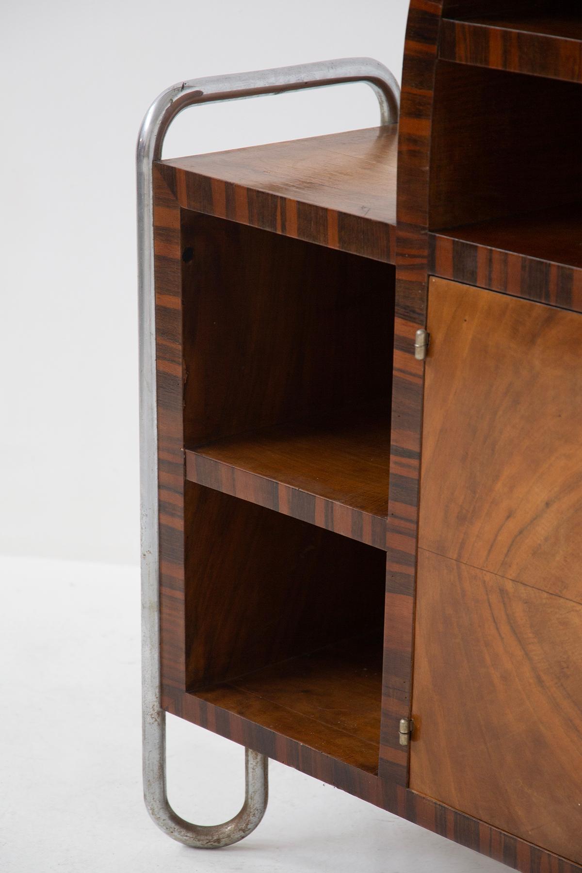 This stunning storage cabinet, with uncertain attribution but strongly influenced by the style of Hynek Gottwald, immediately captures attention with its modernist lines and perfect balance of materials and design. Created during the era of European