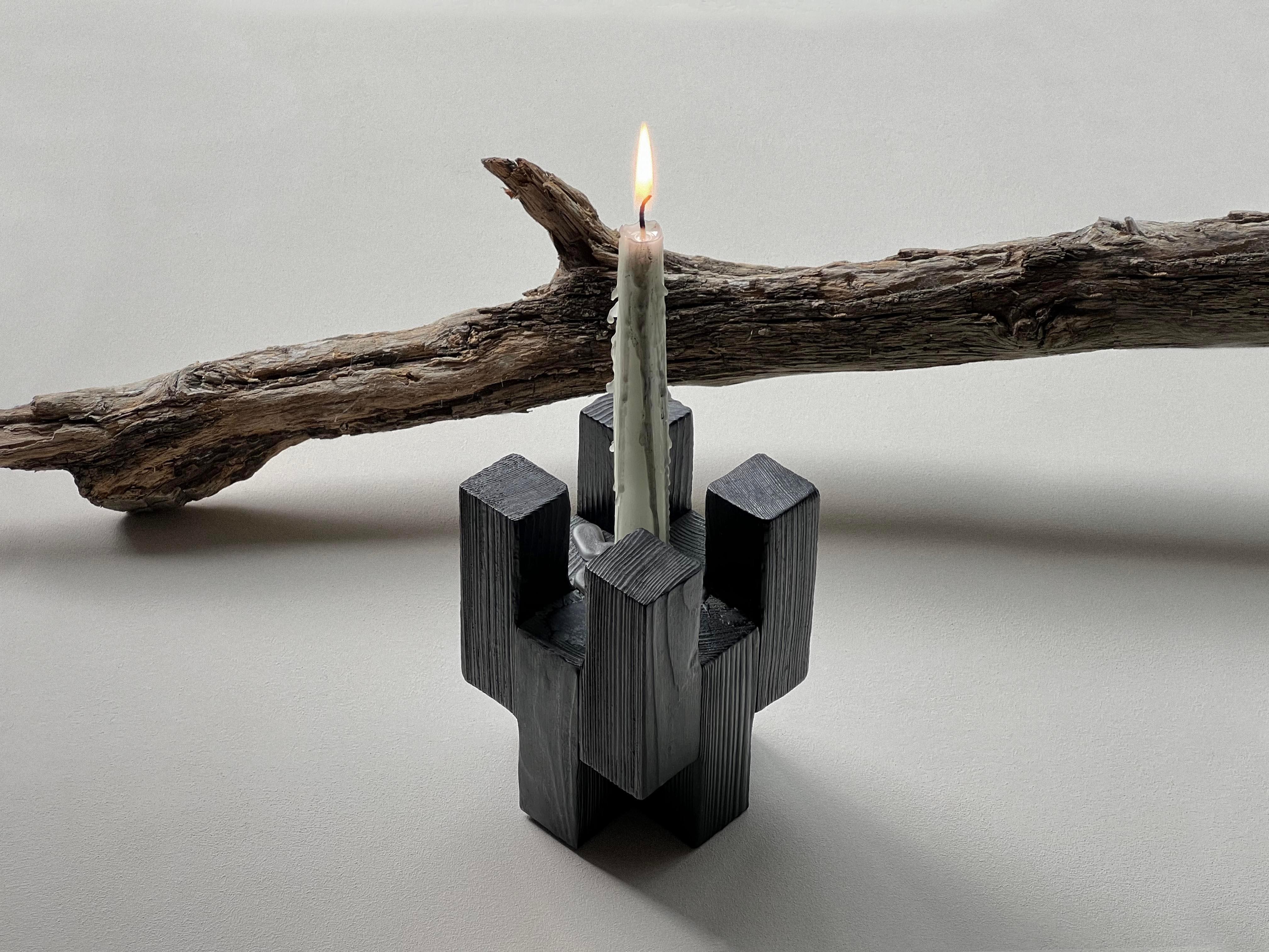 Brick Candle Holder by Nana Zaalishvili
Dimensions: D 9 x W 9 x H 13 cm.
Materials: Burnt and painted wood.

‘Brick’ is the first attempt by Idaaf Architects workshop to create a new building material. White the process of selecting its textures is