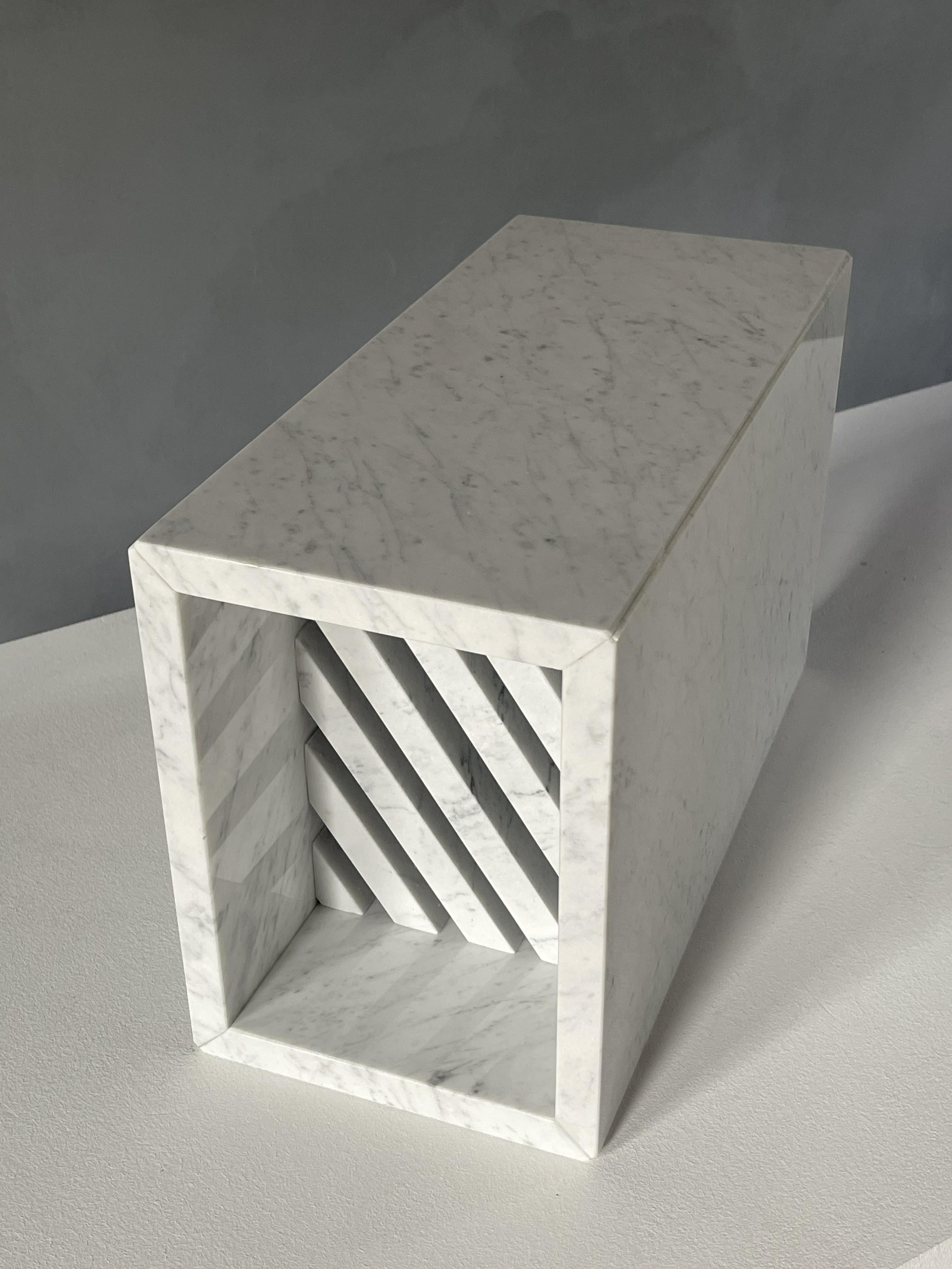 BRICK II Side Table / Grégoire de Lafforest
2014 / White Carrara Marble
26 x 19 x h. 42

Bedside table, magazine rack, mini bookshelf, side table, tidy… Brick is plural. A tribute to the architectural modules, a precious and precise review of bricks