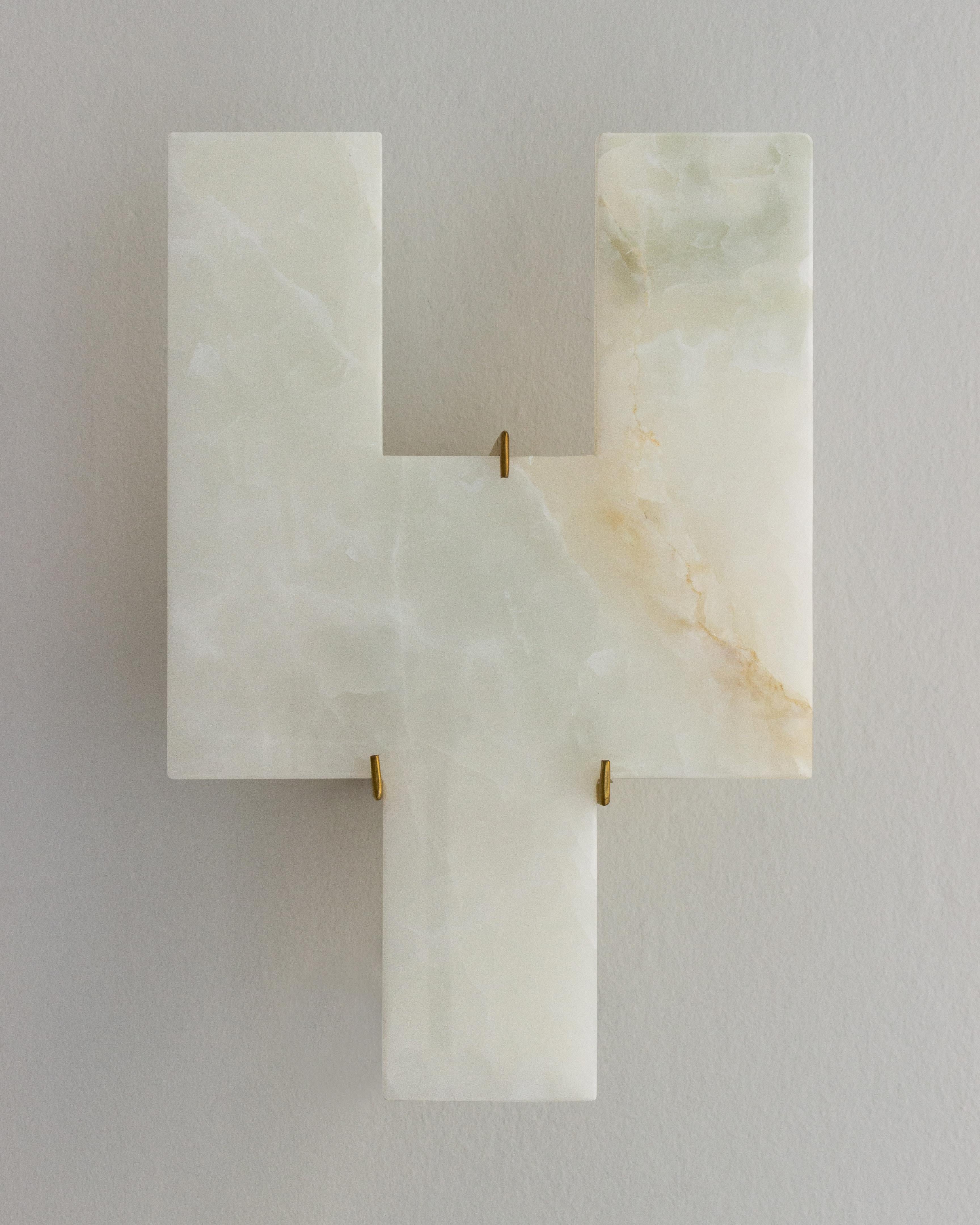 Brick Onyx Wall Lamp by Nana Zaalishvili
Dimensions: D 15 x W 30 x H 45 cm.
Materials: Onyx and brass.

‘Brick’ is the first attempt by Idaaf Architects workshop to create a new building material. White the process of selecting its textures is at