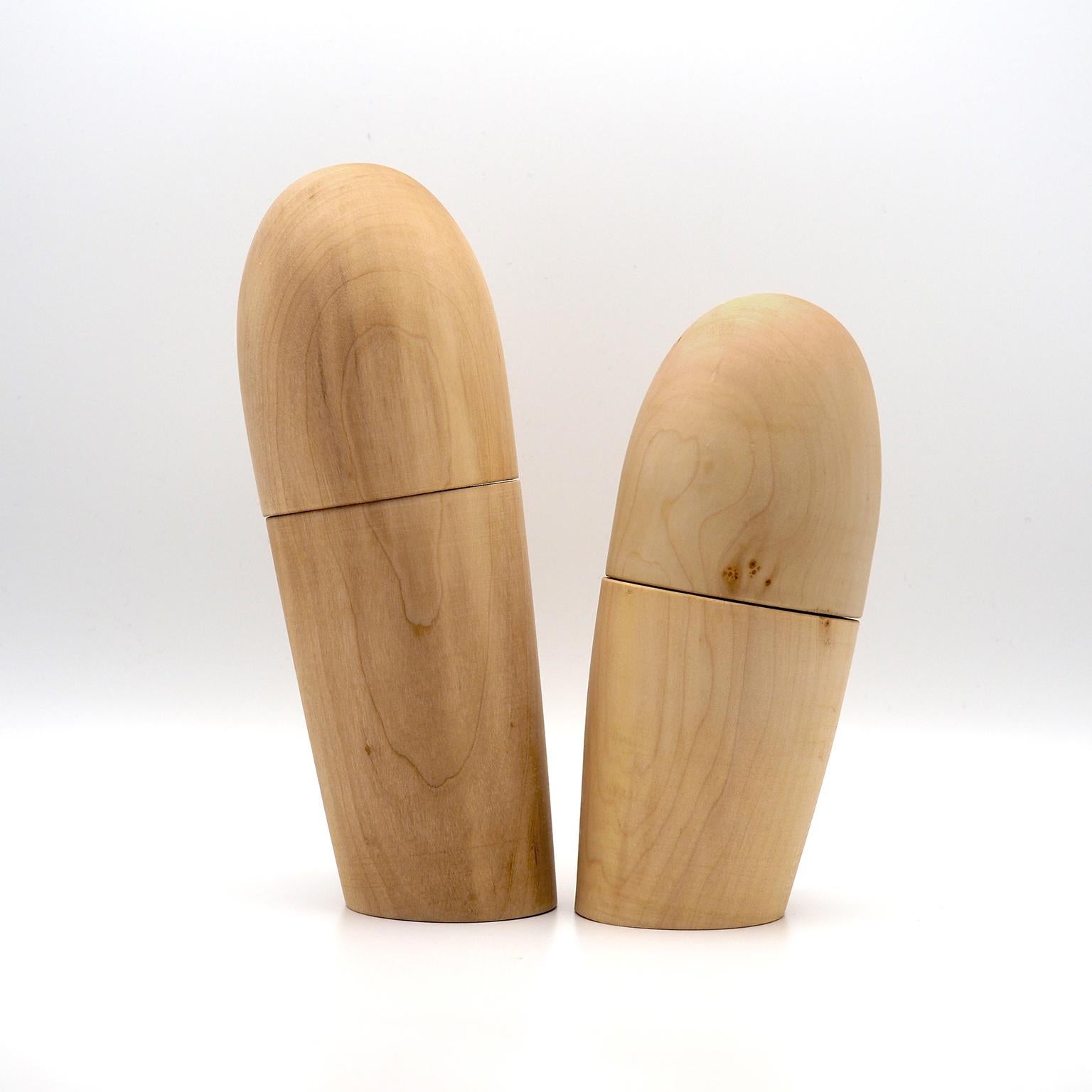 Unusual pair of salt and pepper mills.
They are handcrafted in maple wood, the internal mechanism is in high-resistance ceramic.
 
