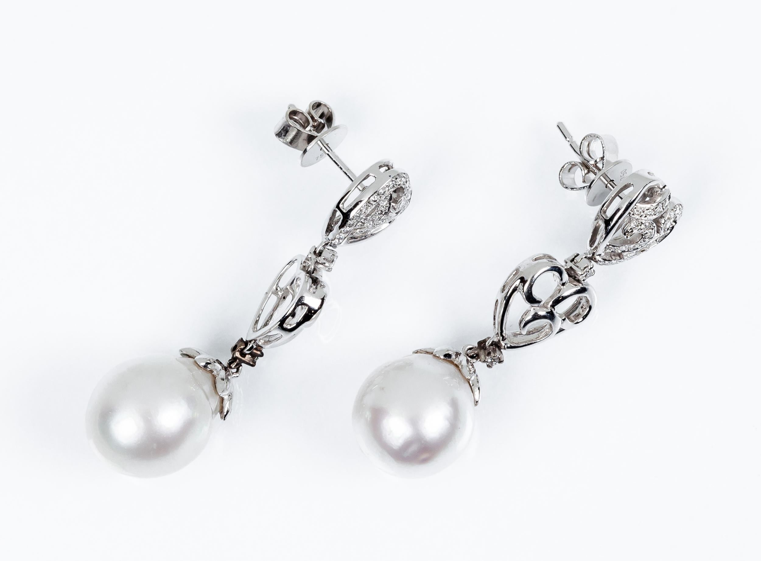 Bridal Australian Pearl 18k White Gold and Pavé Diamond Earrings
PRADERA BRIDAL Collection 
White Australian Pearl 12mm
Length of earrings 40mm
Diamonds 60  aprox 0,30ct  Color H and Clarity VS

Irama Pradera is a Young designer from Spain that