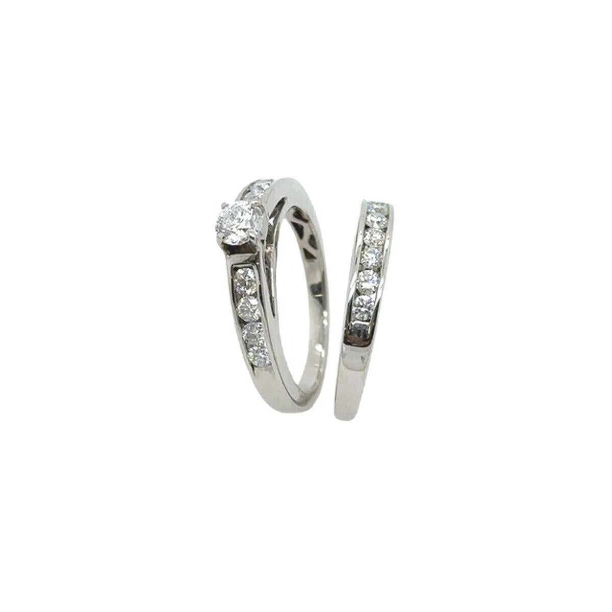Bridal Set In 18ct White Gold , Engagement Ring0.65ct + 0.35ct Wedding Ring

Additional Information:
Total Diamond Weight : 0.65ct+0.35ct 
 Diamond Colour: H
 Diamond Clarity: SI
Total  Weight: 5.5g
Ring Size: K1/2
Width of Band: 1.72mm/1.85mm
Width