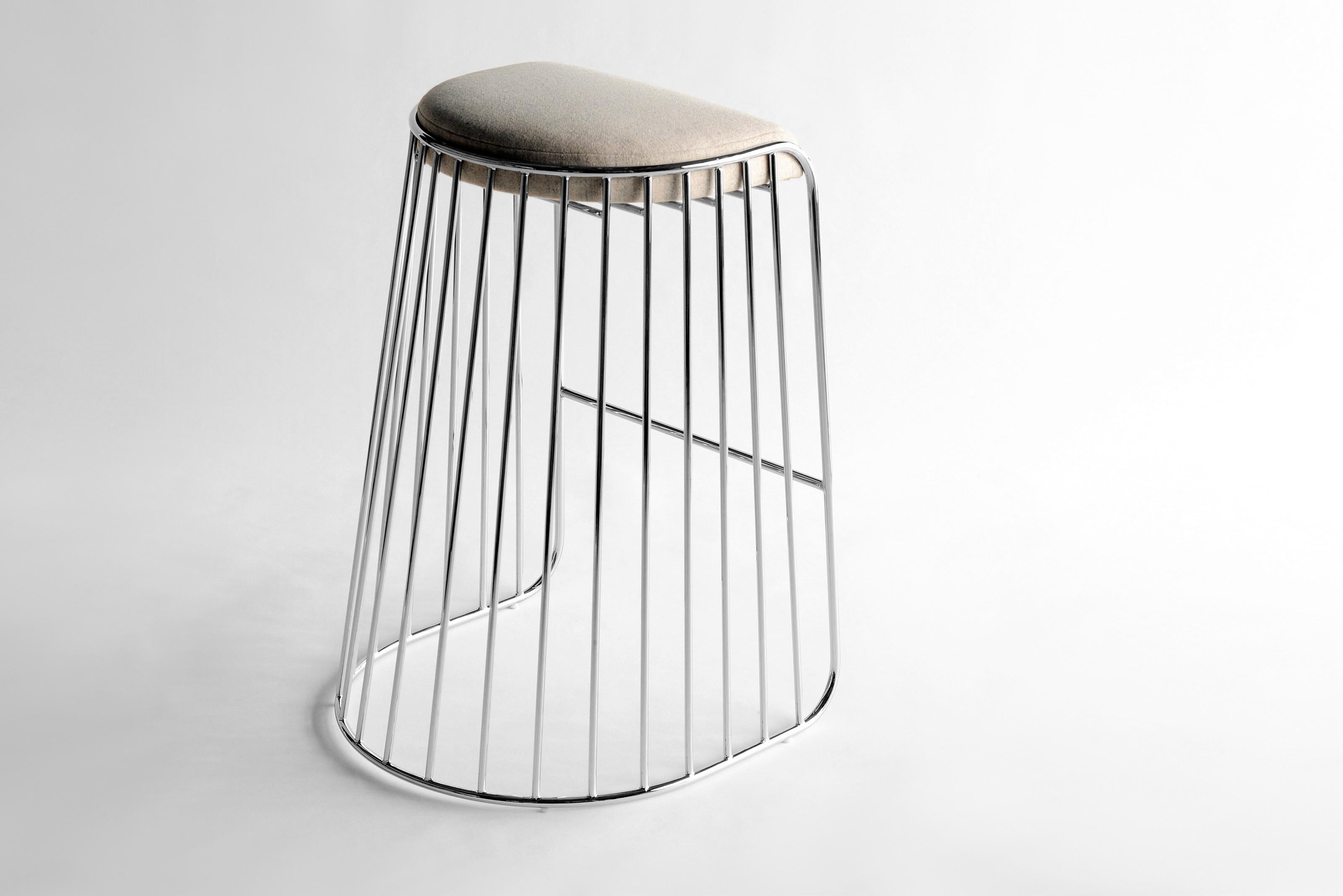 Bride’s Veil Counter Stool by Phase Design
Dimensions: D 52,1 x W 53,3 x H 63,5 cm.
Materials: Upholstery, steel and polished chrome.

Solid steel bar available in a smoked brass, polished chrome, burnt copper, or powder coat finish with upholstered