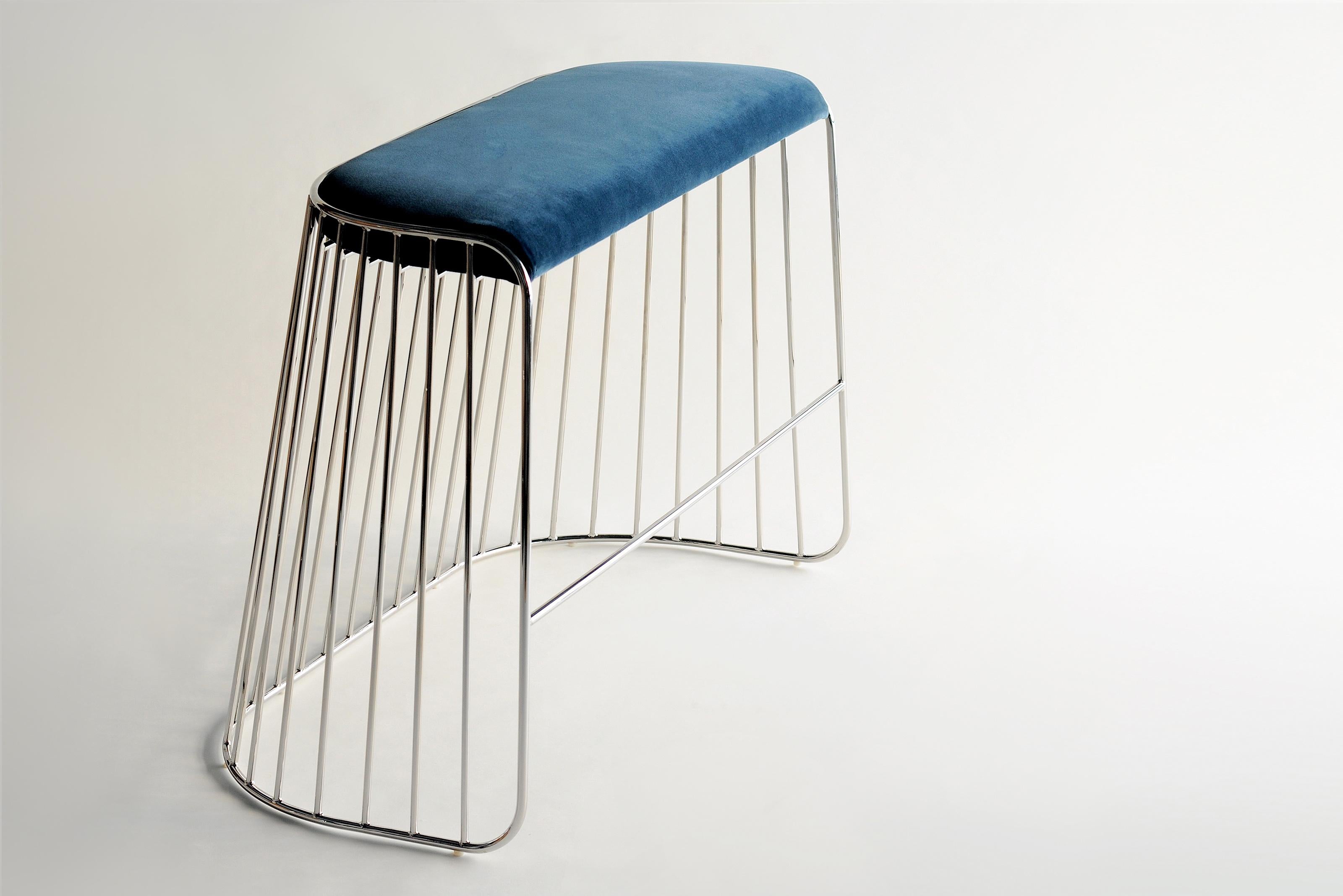 Bride’s Veil Double Low Stool by Phase Design
Dimensions: D 52,1 x W 109,2 x H 45,7 cm.
Materials: Upholstery, steel and polished chrome.

Solid steel bar available in a smoked brass, polished chrome, burnt copper, or powder coat finish with