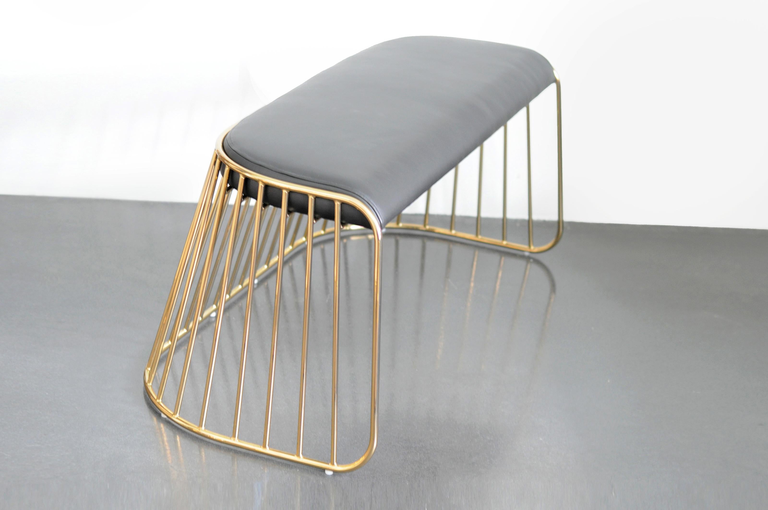 Bride’s Veil Double Low Stool by Phase Design
Dimensions: D 52,1 x W 109,2 x H 45,7 cm.
Materials: Leather, steel and smoked brass.

Solid steel bar available in a smoked brass, polished chrome, burnt copper, or powder coat finish with upholstered