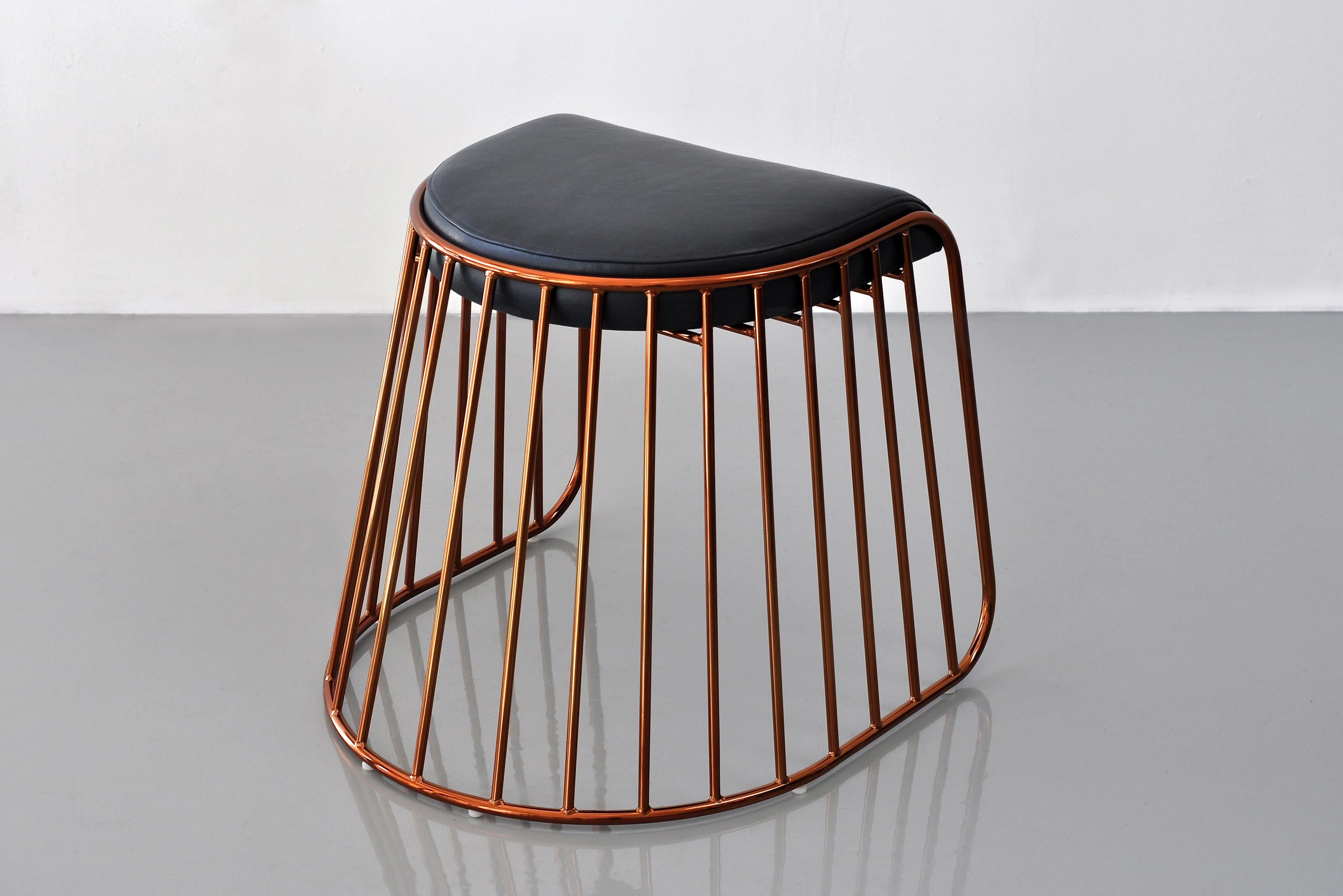 Bride’s Veil Low Stool by Phase Design
Dimensions: D 52,1 x W 53,3 x H 45,7 cm.
Materials: Upholstery, steel and burnt copper.

Solid steel bar available in a smoked brass, polished chrome, burnt copper, or powder coat finish with upholstered top.