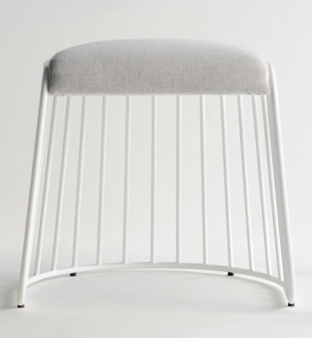 Bride’s Veil Low Stool by Phase Design
Dimensions: D 52,1 x W 53,3 x H 45,7 cm.
Materials: Upholstery and powder-coated steel.

Solid steel bar available in a smoked brass, polished chrome, burnt copper, or powder coat finish with upholstered top.