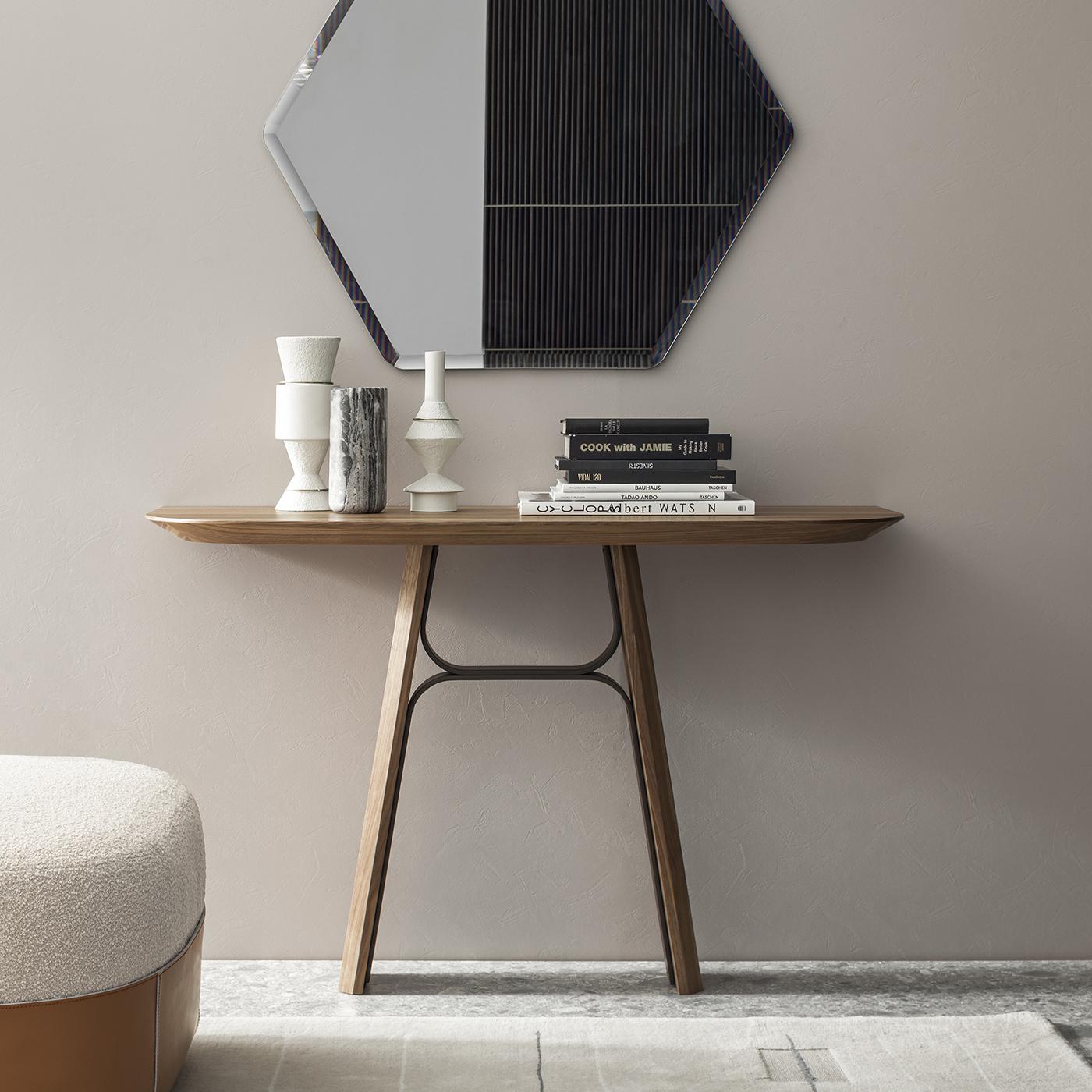 Dynamic and harmonious in its silhouette inspired by fluid-lined bridges, this console was designed and crafted with painstaking attention to detail borrowed from haute couture. Curved metal beams reinforce the slanted legs, which share with the
