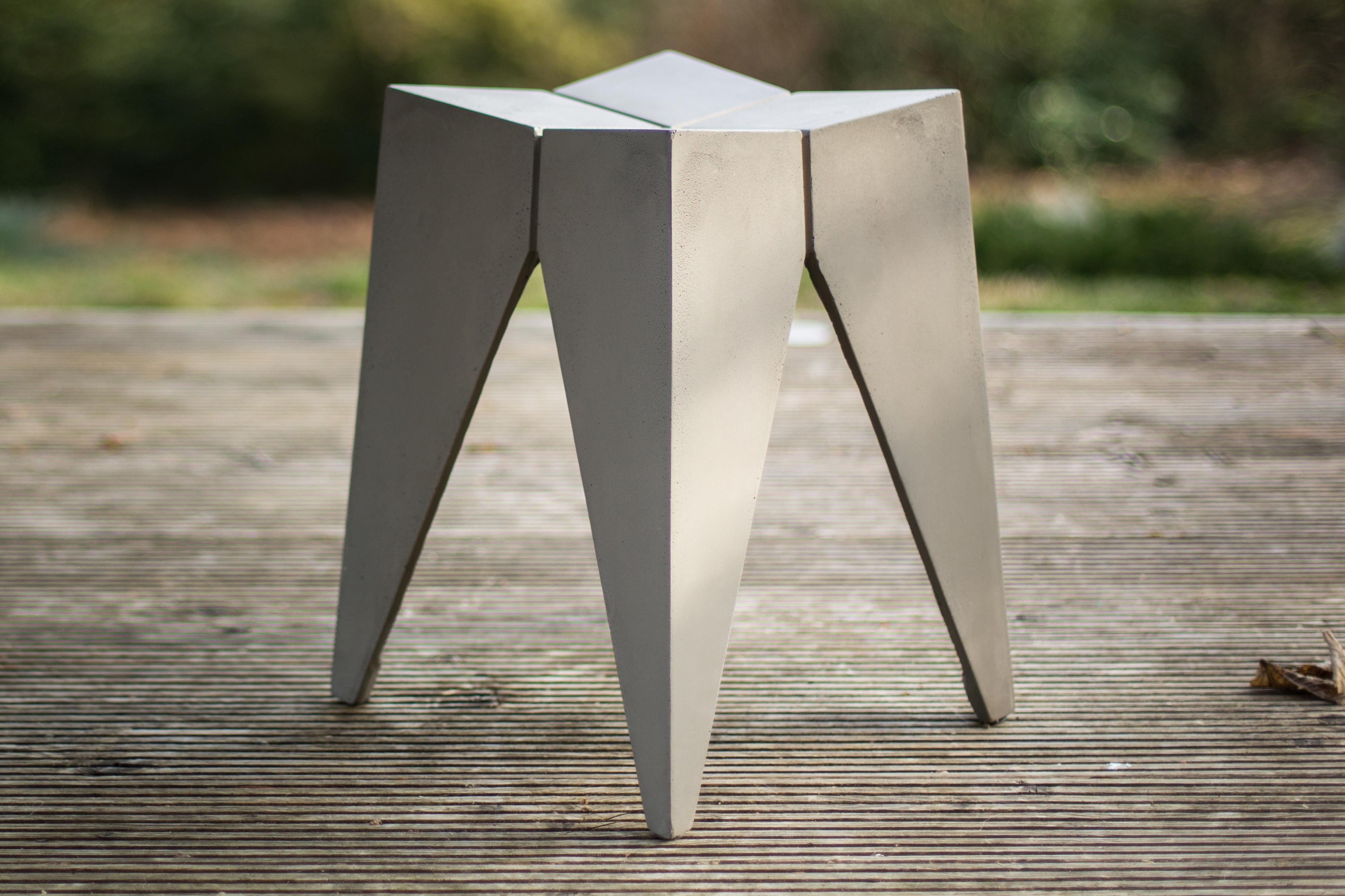 The Concrete Bridge stool designed by Henri Lavallard Boget for Lyon Béton, has a bold sculptural shape which heightens the industrial aesthetic. Elegant and practical, the concrete stool is perfect as a stool for the living room, bedroom, bathroom