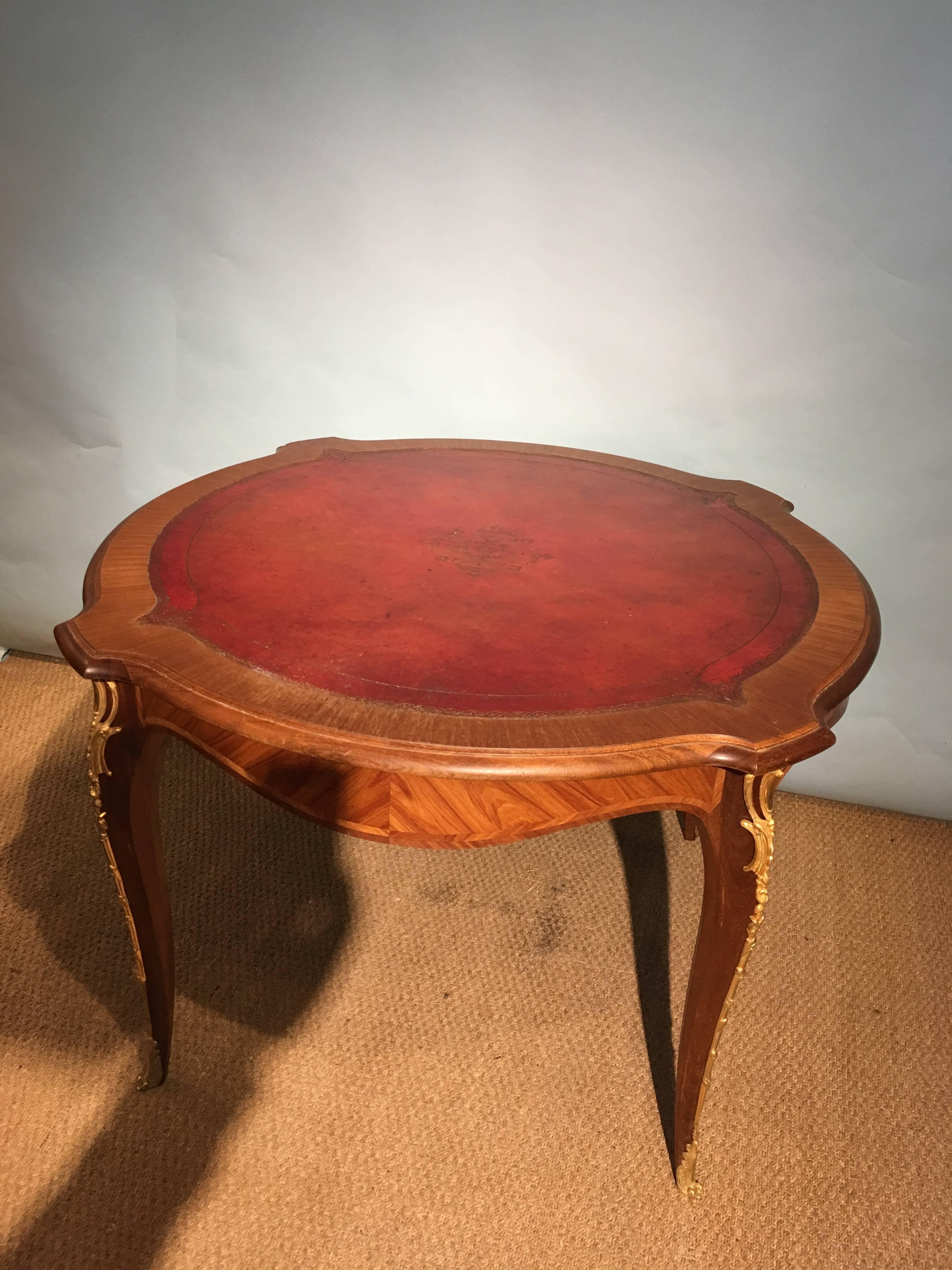 Very stylish centre table / bridge table 

French dating to circa 1930s with original tooled leather insert Paris quality ormolu mounts 

Measure: Diameter 47 inches or 120 cms 
Height 29 inches or 75 cms.