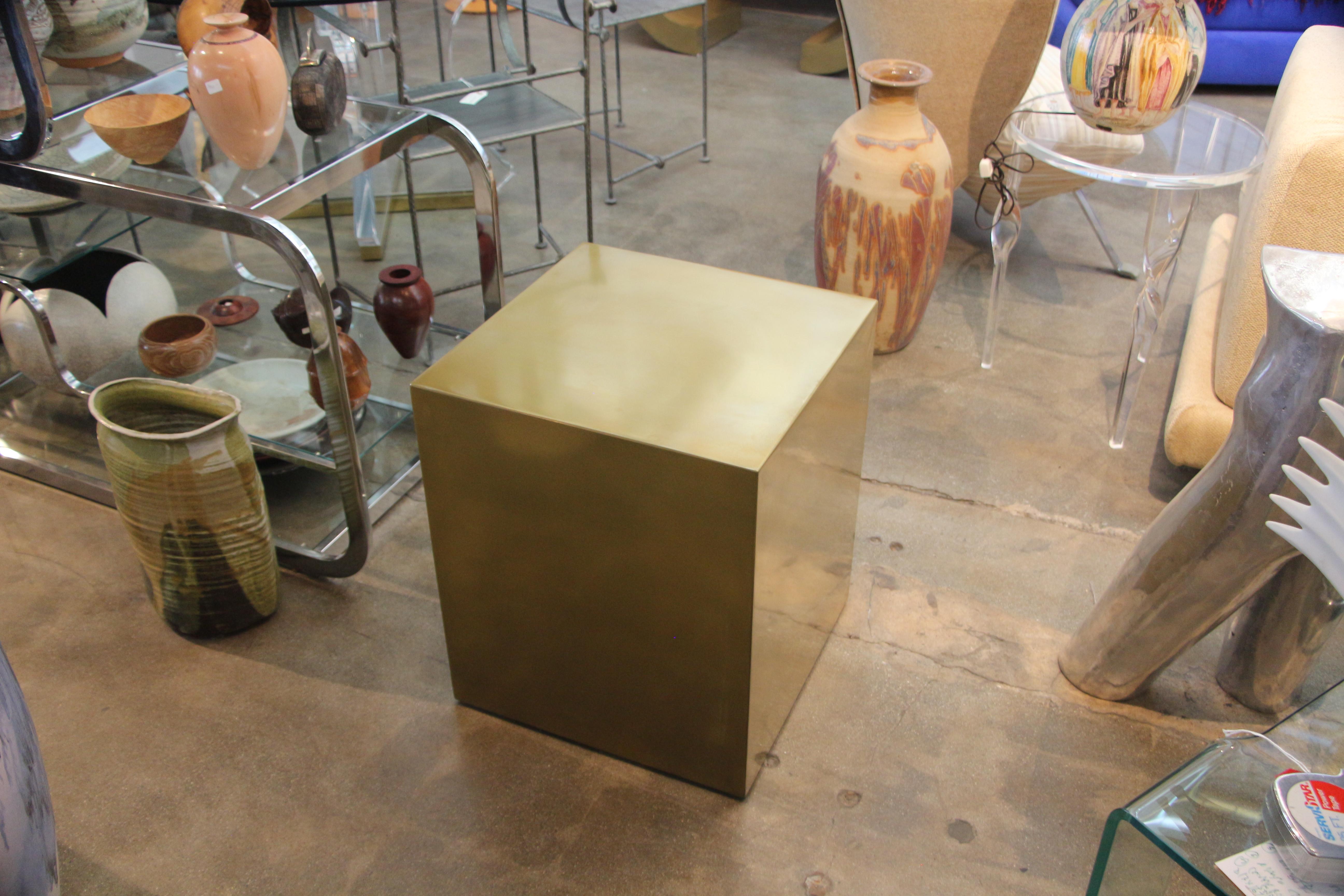 A bridges over time originals brass coated cube table designed by MarCo Antonio. It is a handmade prototype but can be ordered in any color and size. Some minor imperfections as it is a prototype and handmade.
A mate can be made to order.