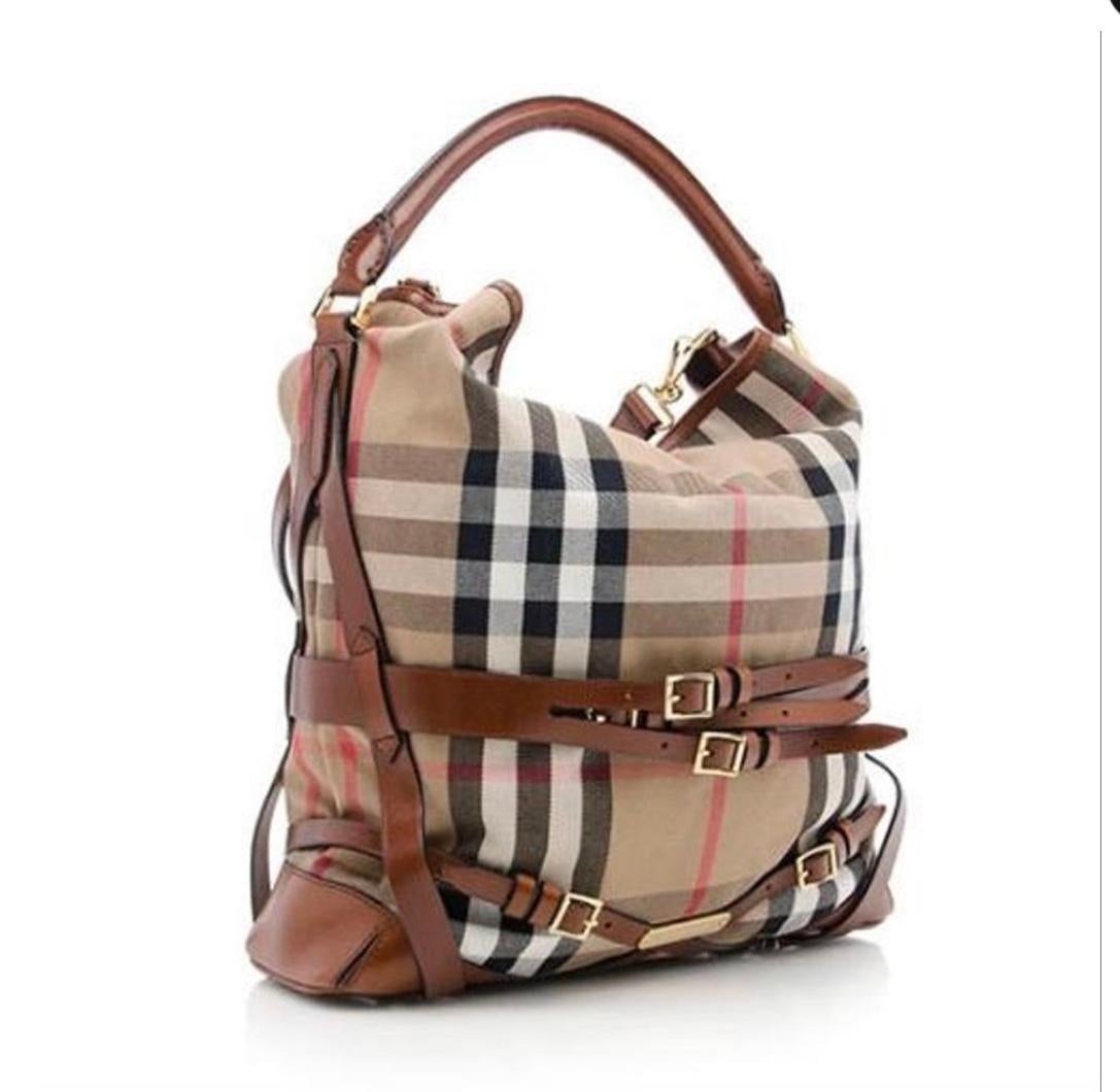 Burberry
Bridle House Check Gosford Large Brown Leather Canvas Hobo Bag
The founder of this timeless and highly popular luxury label was draper Thomas Burberry, who opened his own outfitting shop in 1856 in the English town of Basingstoke.
has a