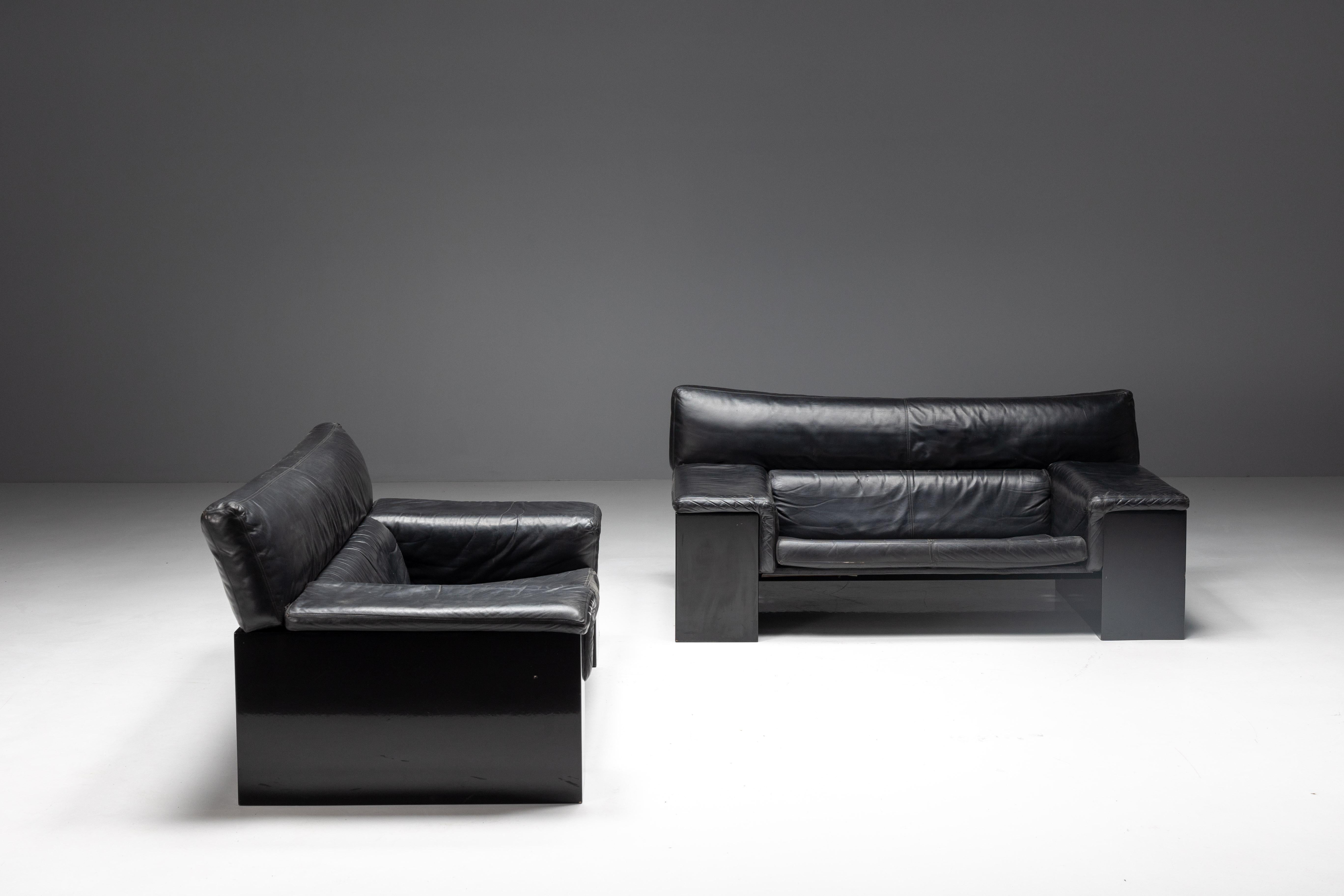 Two exceptional sofas from the award-winning Brigadier Series by renowned Italian architect and designer, Cini Boeri (1924–2020). Crafted in the 1980s for Knoll, these sofas feature a sleek black high-gloss lacquered wooden frame complemented by