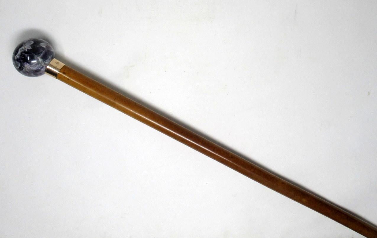 Superb rare polished Malacca walking cane of outstanding quality by Charles Cooke. 

The dark well veined Blue John pommel of generous size above a plain gold collar on a tapering shaft with original extra-long bone ferrule.
Mark of CC for