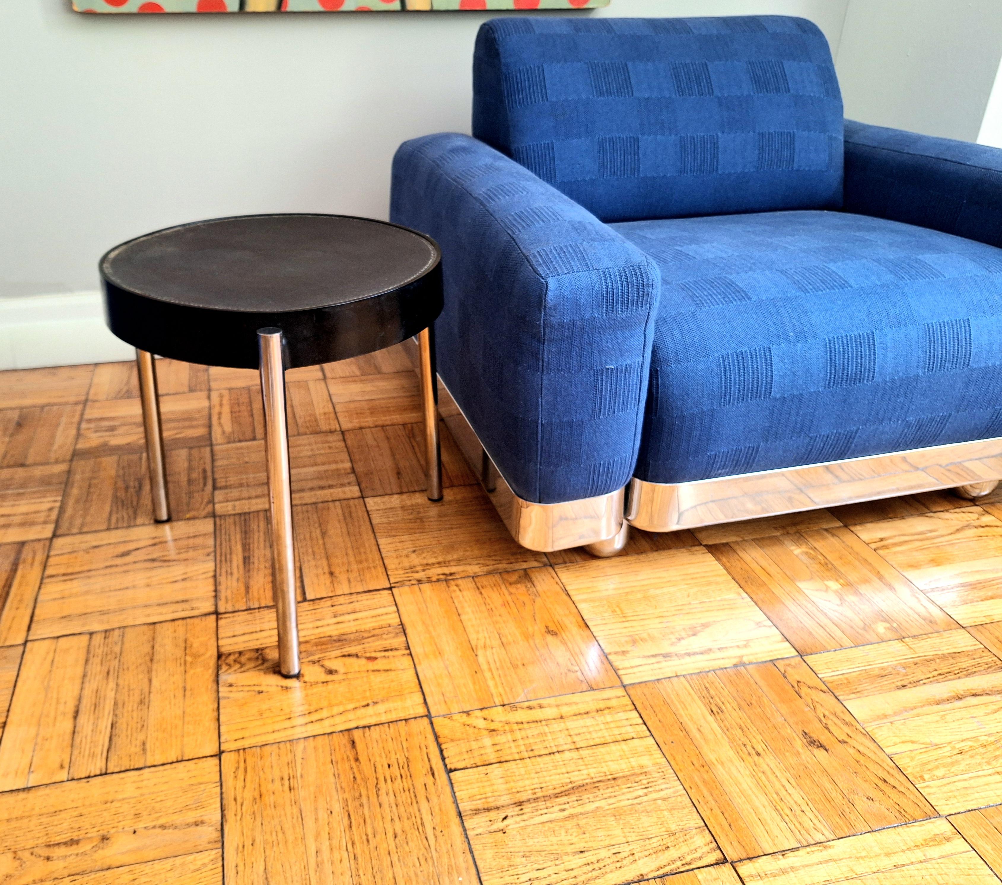 Brighella 634 side table from the Historical Archive collection of Zanotta Spa., 1980s. Top is stain resistant black leather stitched into a black lacquer hard polyurethane top and is supported by three tubular stainless steel legs.
