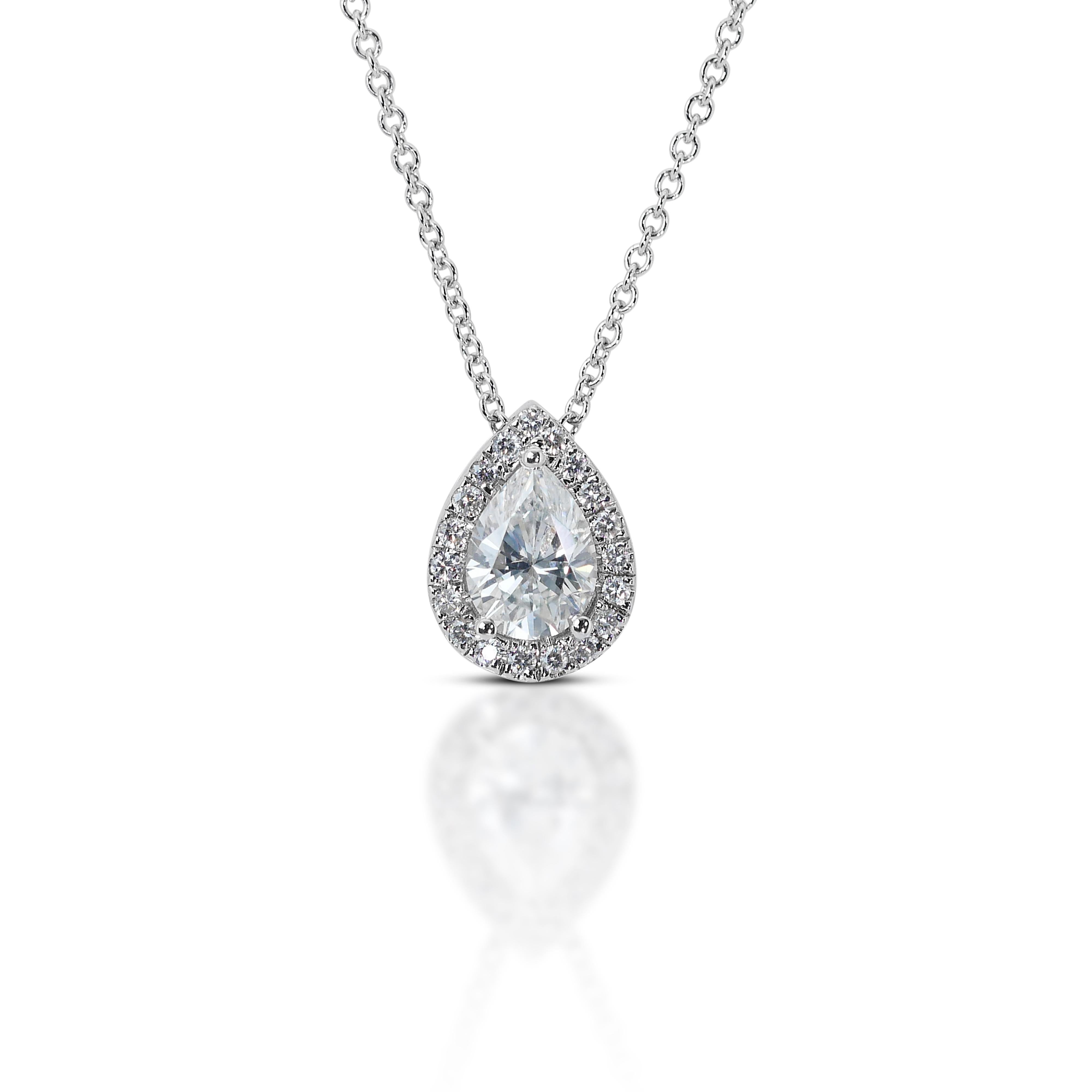 18kt White Gold Ideal Cut 1.00 ct Diamond Pendant - GIA Certified
Crafted with meticulous attention to detail, this pendant features a brilliant-cut diamond as the centerpiece, surrounded by a halo of smaller diamonds, creating a mesmerizing display
