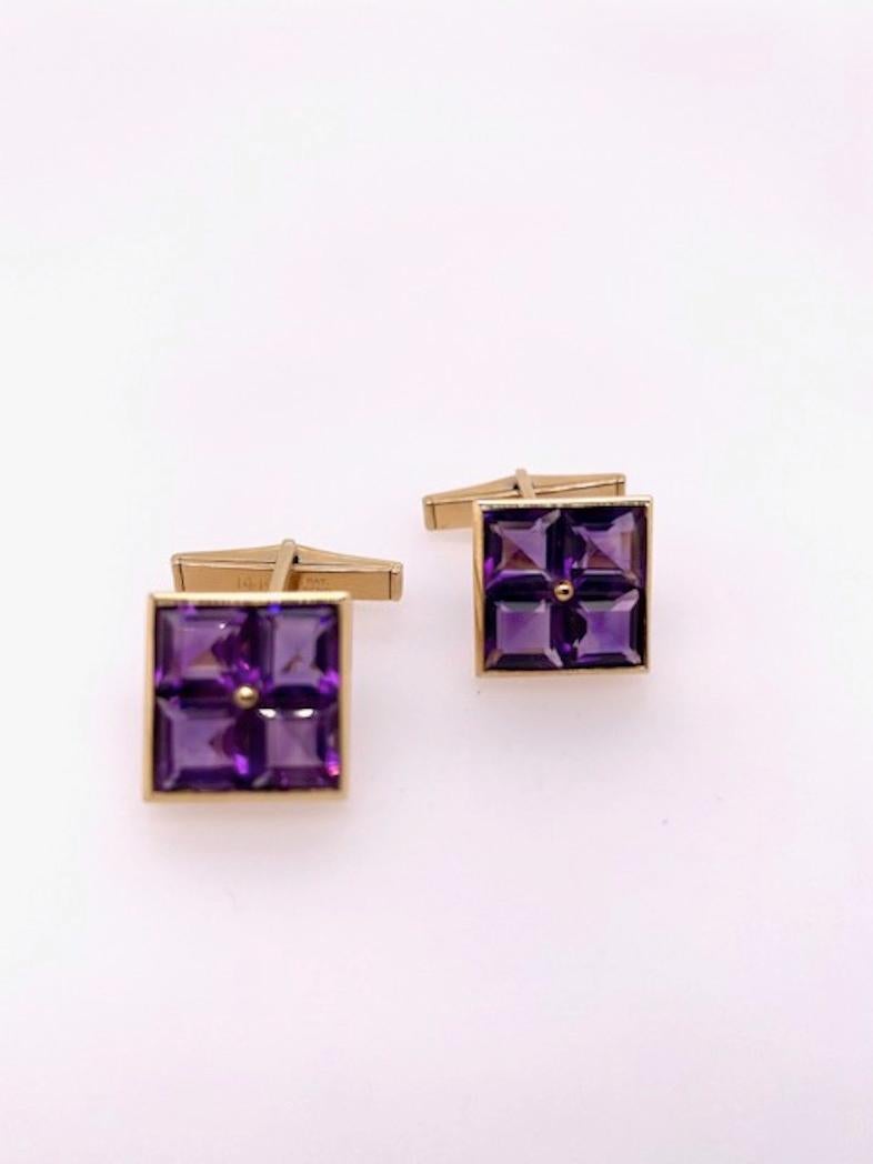 Distinctive cufflinks  Four faceted square-cut amethysts, set in a 14K yellow gold border, with a gold bead in the center.  T-bar closure.  Solid and substantial.  2/3