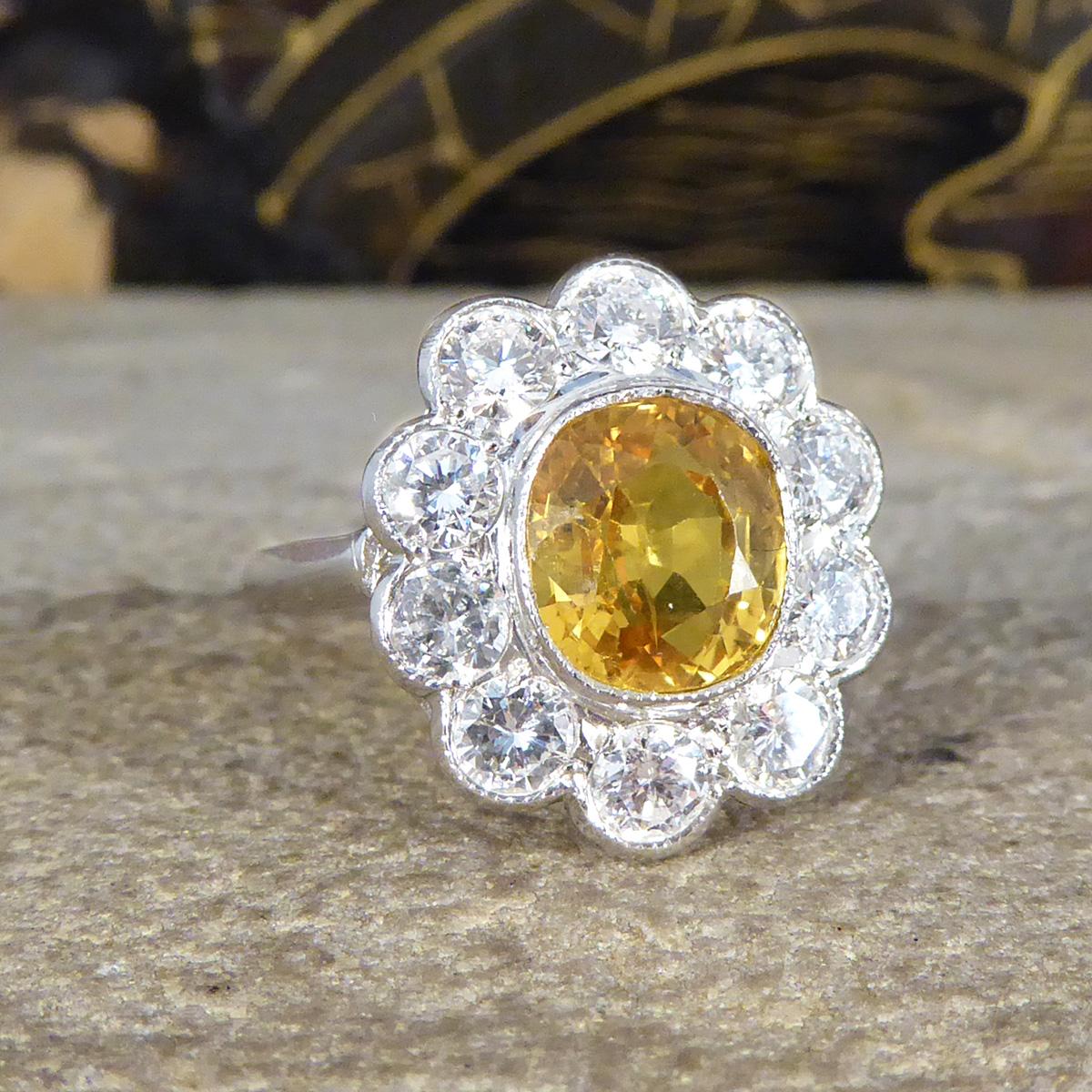 This beautiful Yellow Sapphire and Diamond cluster ring would make the perfect engagement or statement ring for anyone that likes a burst of colour. It has been crafted to reflect a sought after Edwardian style ring. Featuring a single 2.90ct