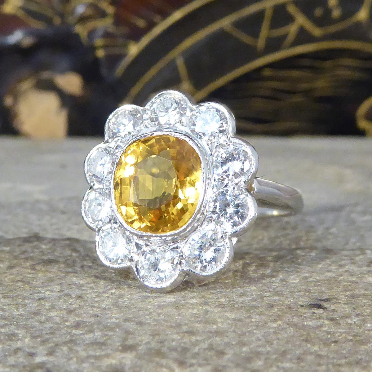 Bright and Rich 2.90ct Cushioned Oval Yellow Sapphire and 1.30ct Diamond Cluster In Excellent Condition For Sale In Yorkshire, West Yorkshire