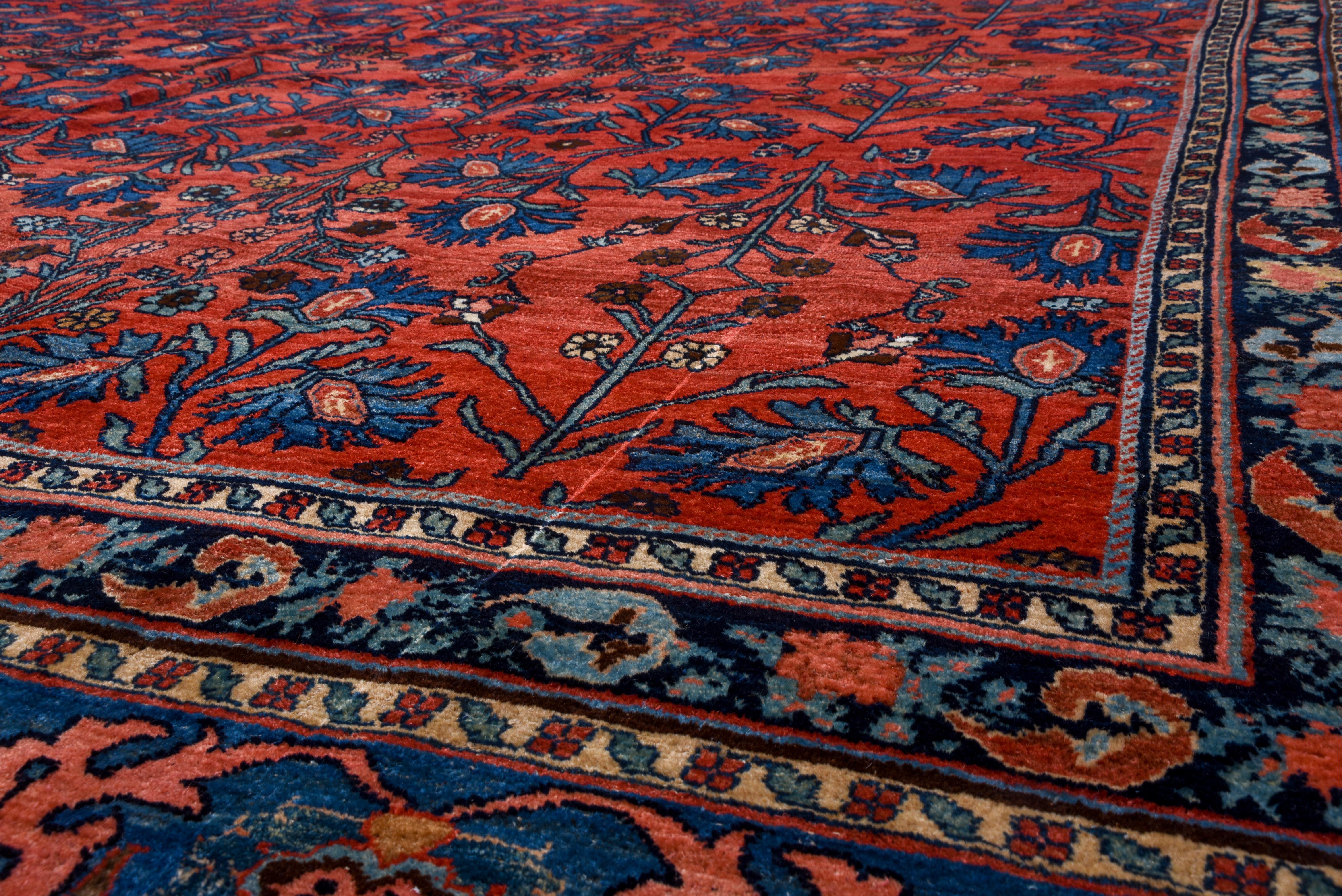 The superbly abrashed royal blue ground displays five repeats of cartouche palmettes, stems, bitonal rough leaves, and short vine segments. The soft coral red border presents geometric palmettes and lancet leaves. A est Persian Kurdish workshop