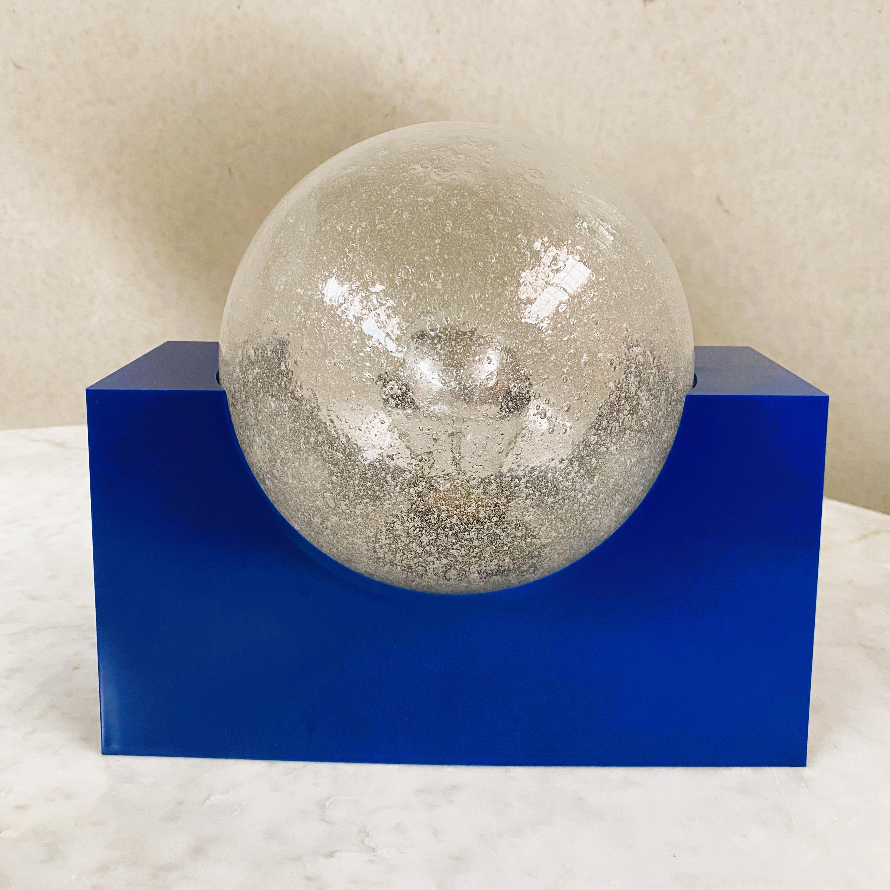 BRIGHT BLUE ACRYLIC BASE AND BUBBLE GLASS SPHERE BY RAAK AMSTERDAM, NETHERLANDS 1970S 

Designer: Raak design team
Manufacturer: Raak Amsterdam
Model: -
Material: Acrylic, bubble glass

Measurements:
Height: 23 cm 
Width: 26 cm 
Depth: 18