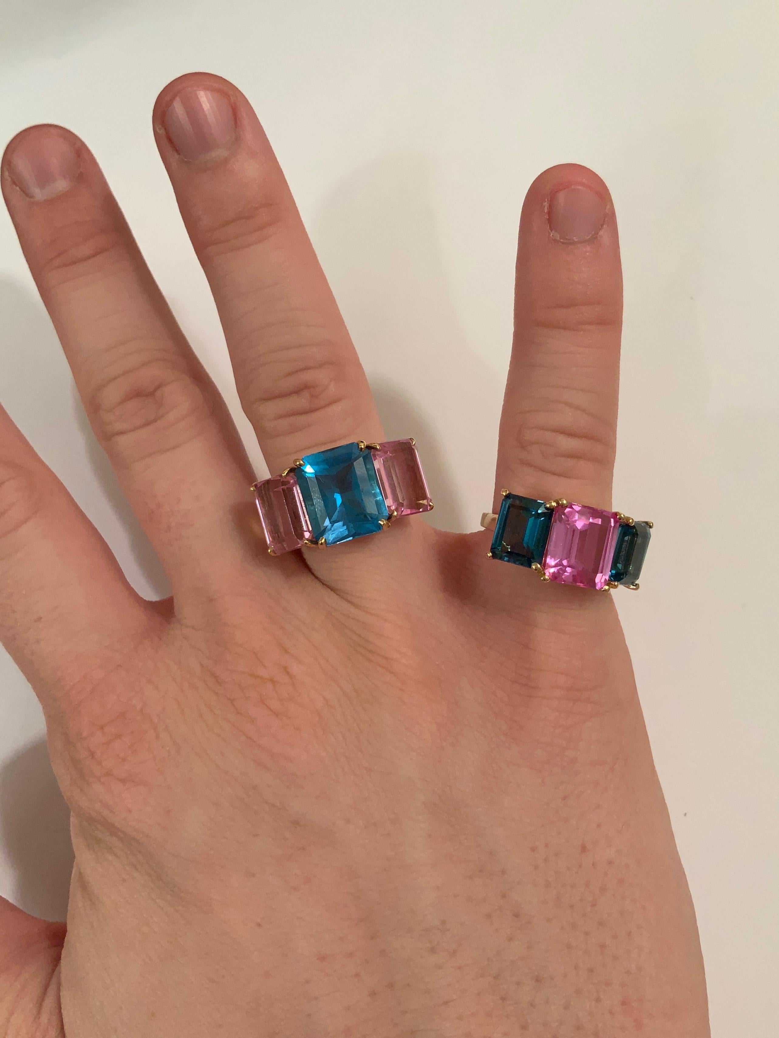 Contemporary Bright Blue and Bright Pink Topaz Emerald cut three stone ring For Sale