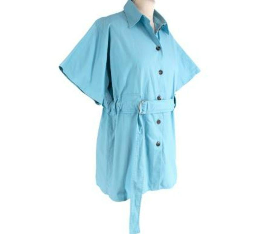 Celine Bright Blue Belted Cotton Shirt
 
 - Bright, turquoise blue hue
 - Airy, slightly structured cotton poplin
 - Classic collar, button-down front with tortoiseshell buttons
 - Integral D-ring waist belt
 - Flared short sleeves 
 - Phoebe Philo