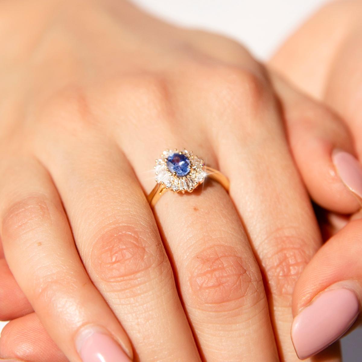 Oval Cut Bright Blue Ceylon Sapphire and Diamond Contemporary 18 Carat Gold Halo Ring