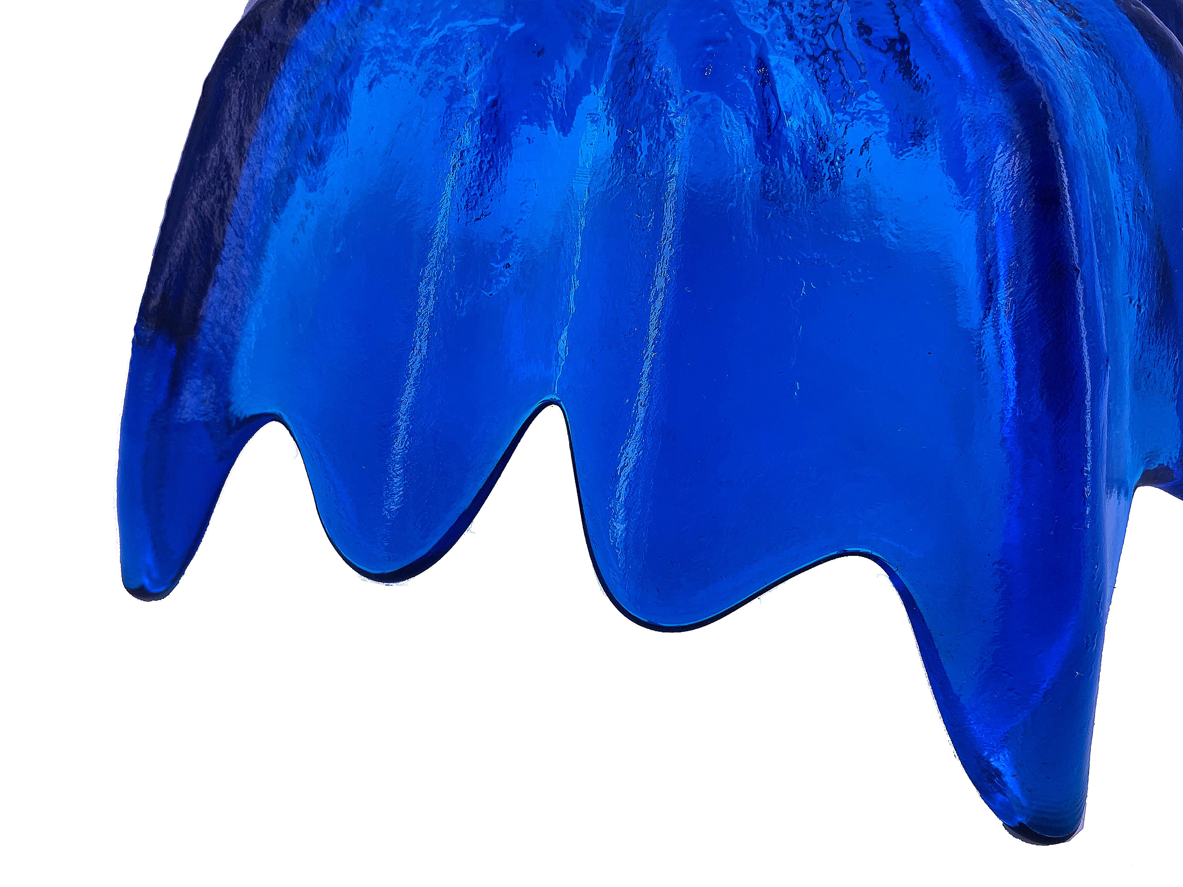 Bright blue glass bowl or centerpiece. This bow is has a beautiful color, shape, and texture.