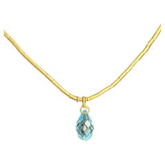 Bright Blue Topaz Gurhan Pendant Necklace On 24k Gold Chin