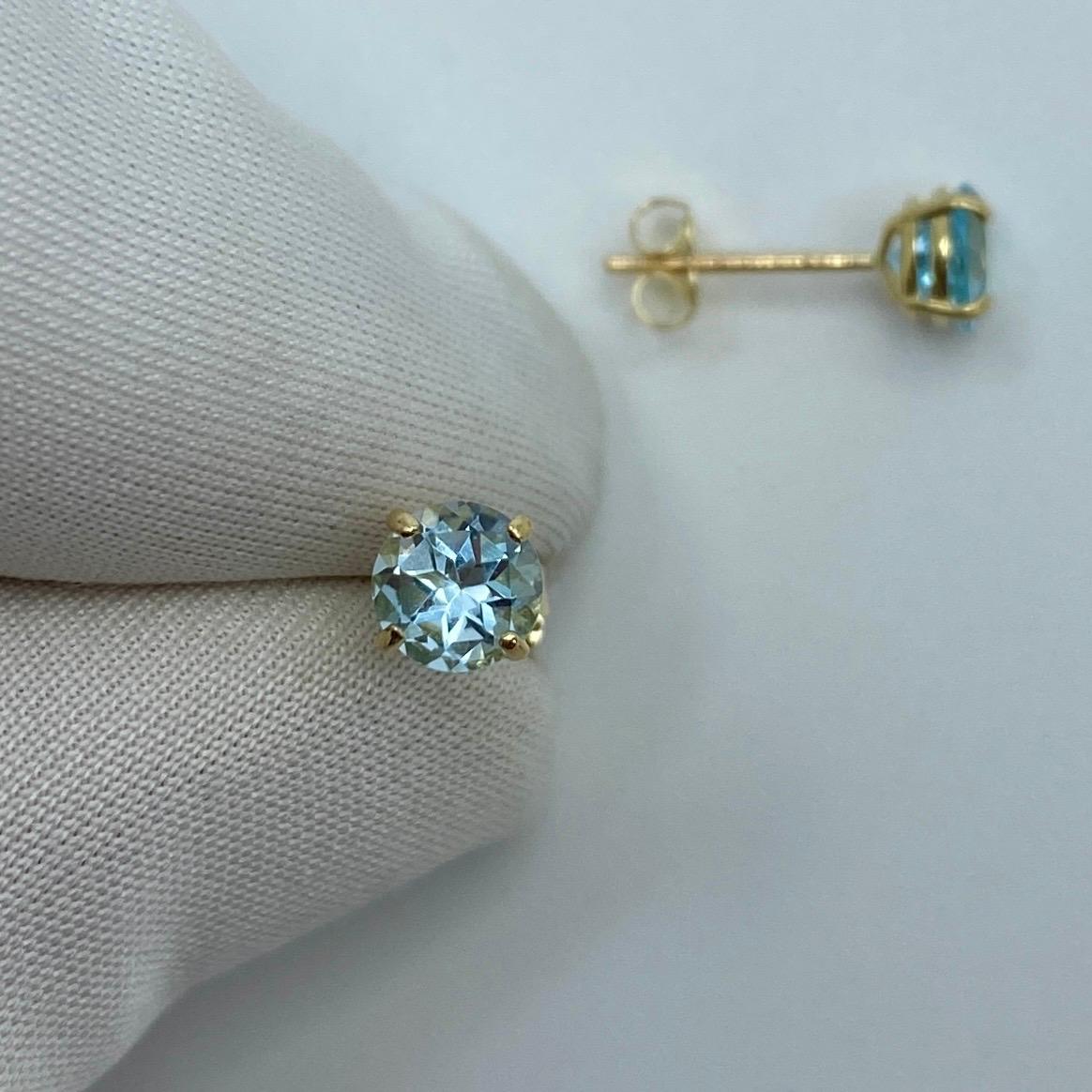 Natural Bright Blue 1.15 Carat Topaz Yellow Gold Earring Studs.

Beautiful 5mm matching pair of round topaz with bright blue colour, excellent clarity and an excellent round brilliant cut.

Set in lightweight 9k yellow gold suds with butterfly