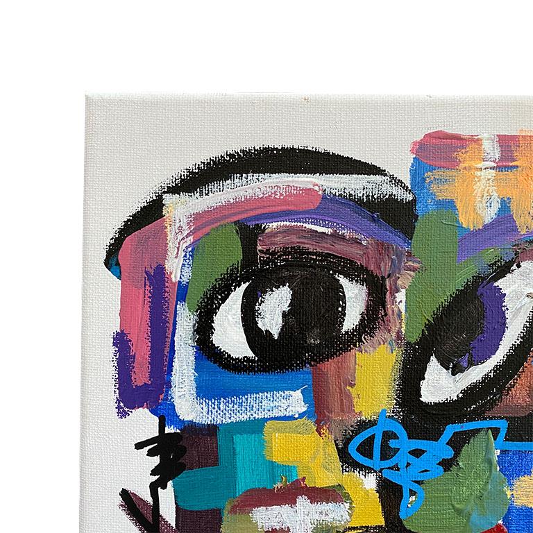 A striking bold abstract portrait painting on canvas. This piece uses bold colors such as blue, pink, yellow, purple and green in geometric lines to depict a portrait of a man. Reminiscent of a Picasso, we love how the artist has given his spin on