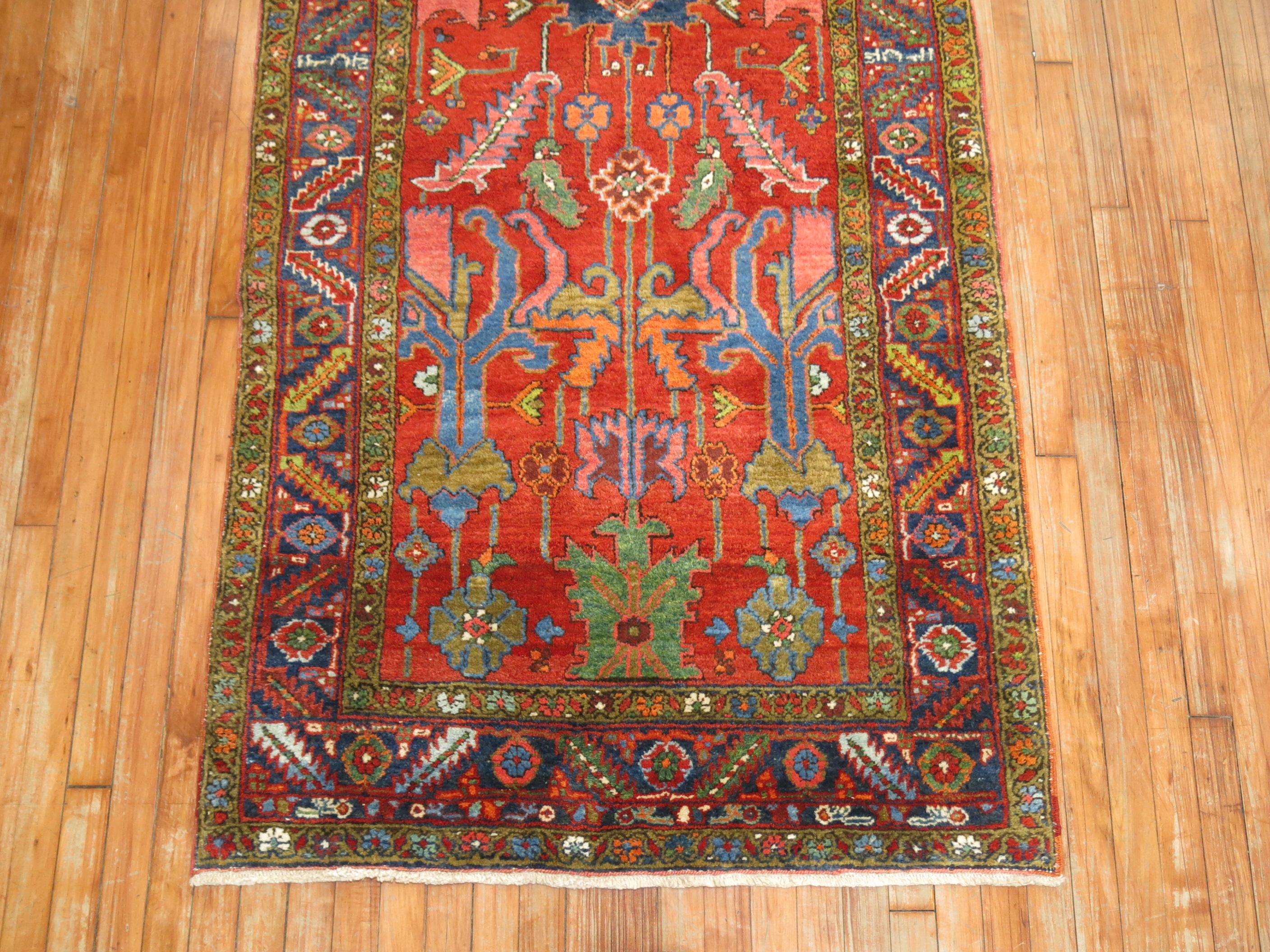 An irregular size vibrant Persian Heriz runner from the second quarter of the 20th century. Vivid red field, with bright green, blue, pink accents, circa 1930.

Measures: 3'7