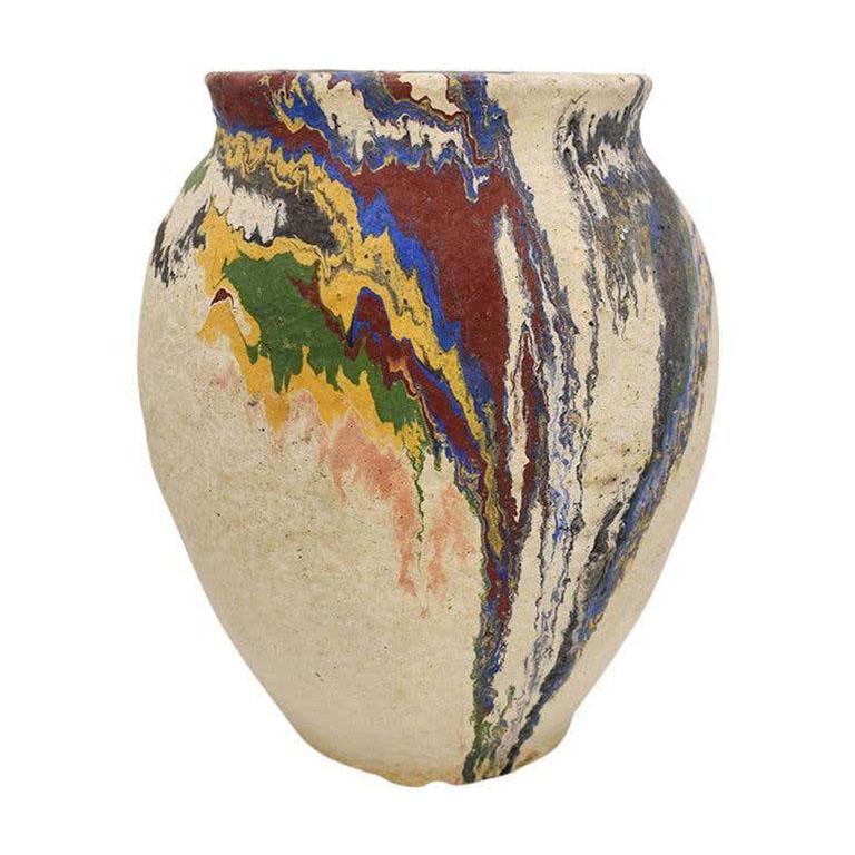 This brightly colored vase is a fabulous example of Ozark pottery. Commonly found on roadside shops in the early 1930s, this piece is hand-painted in a 